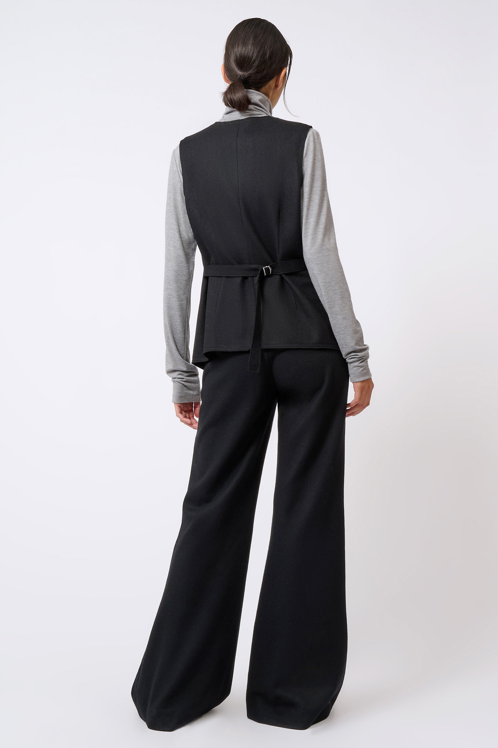 Kal Rieman Raw Edge Vest in Black on Model Wearing Turtleneck Underneath Full Back View