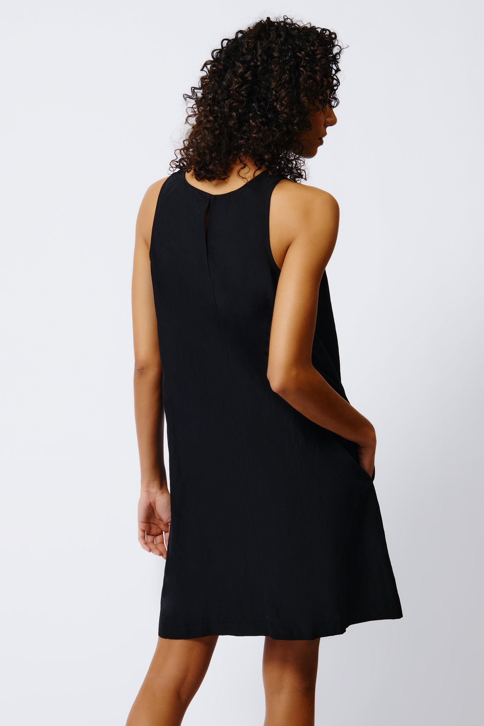 kal rieman trapeze dress in black on model back view crop alternative view