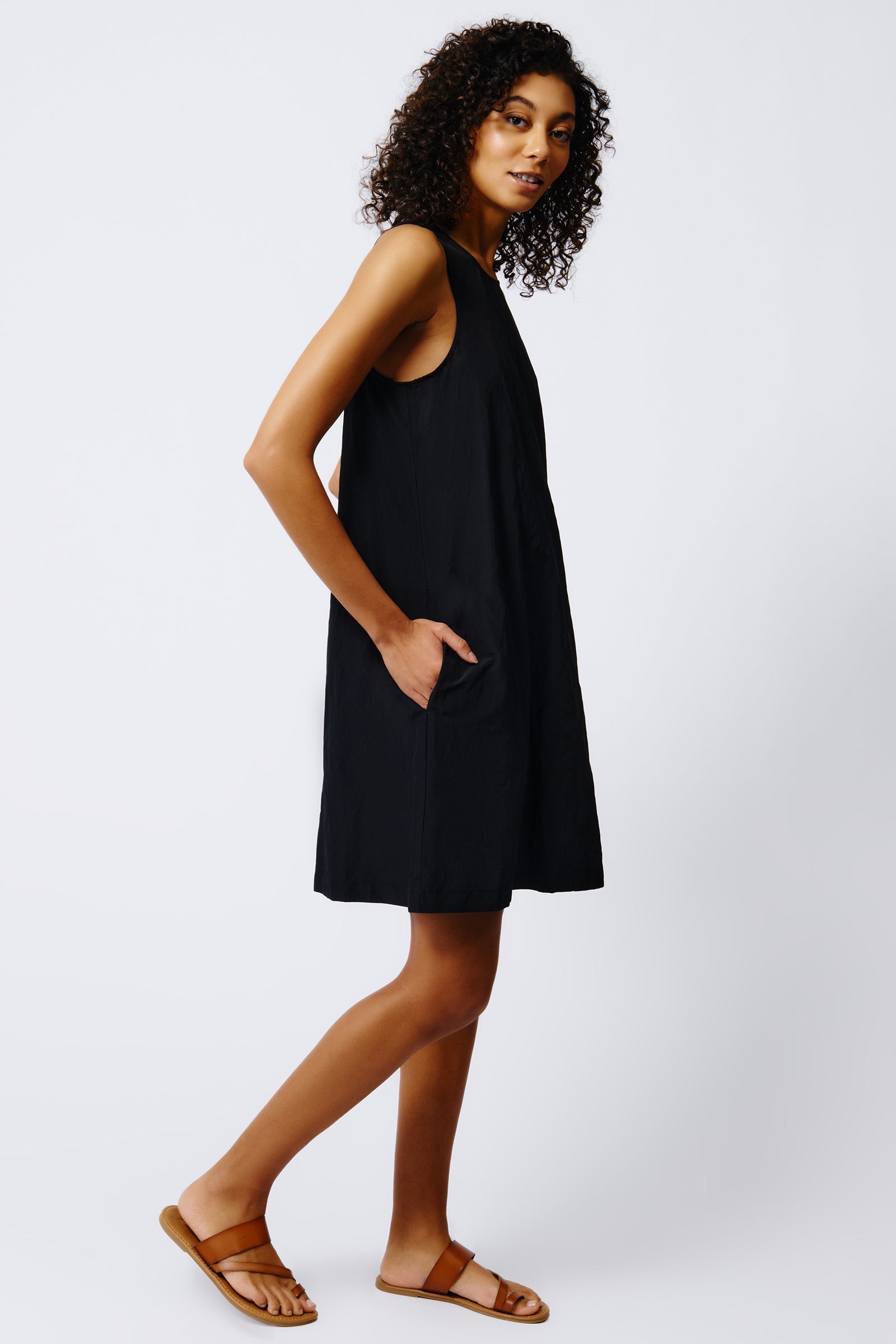 kal rieman trapeze dress in black on model side view crop
