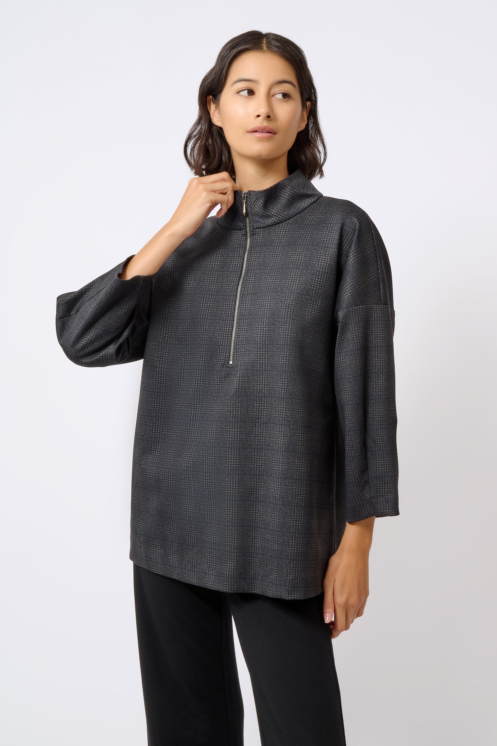 Kal Rieman Zip Mock Top in Black Plaid on Model Looking Left Front View