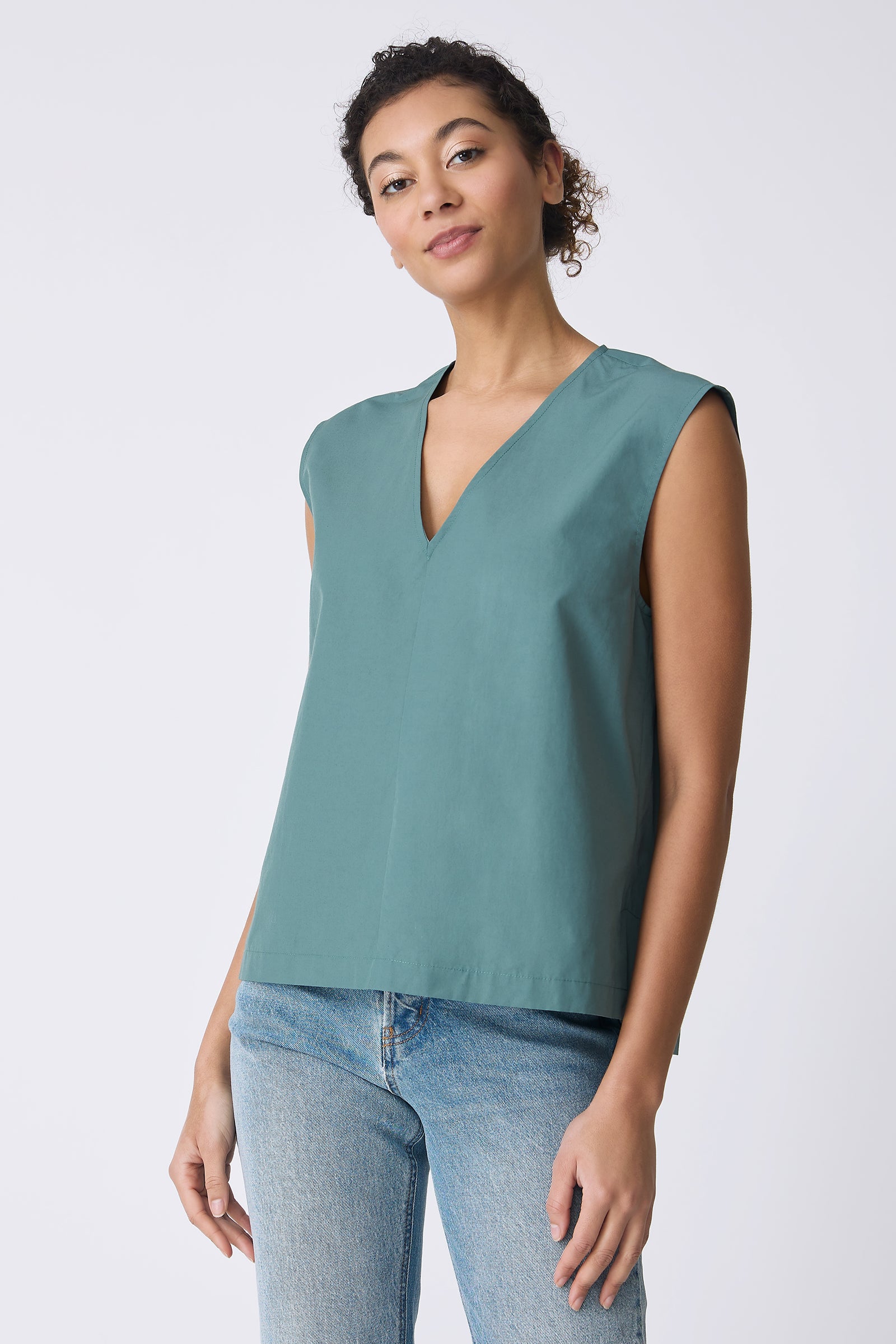 Ava V-Neck Shell Top in Sage on model front view