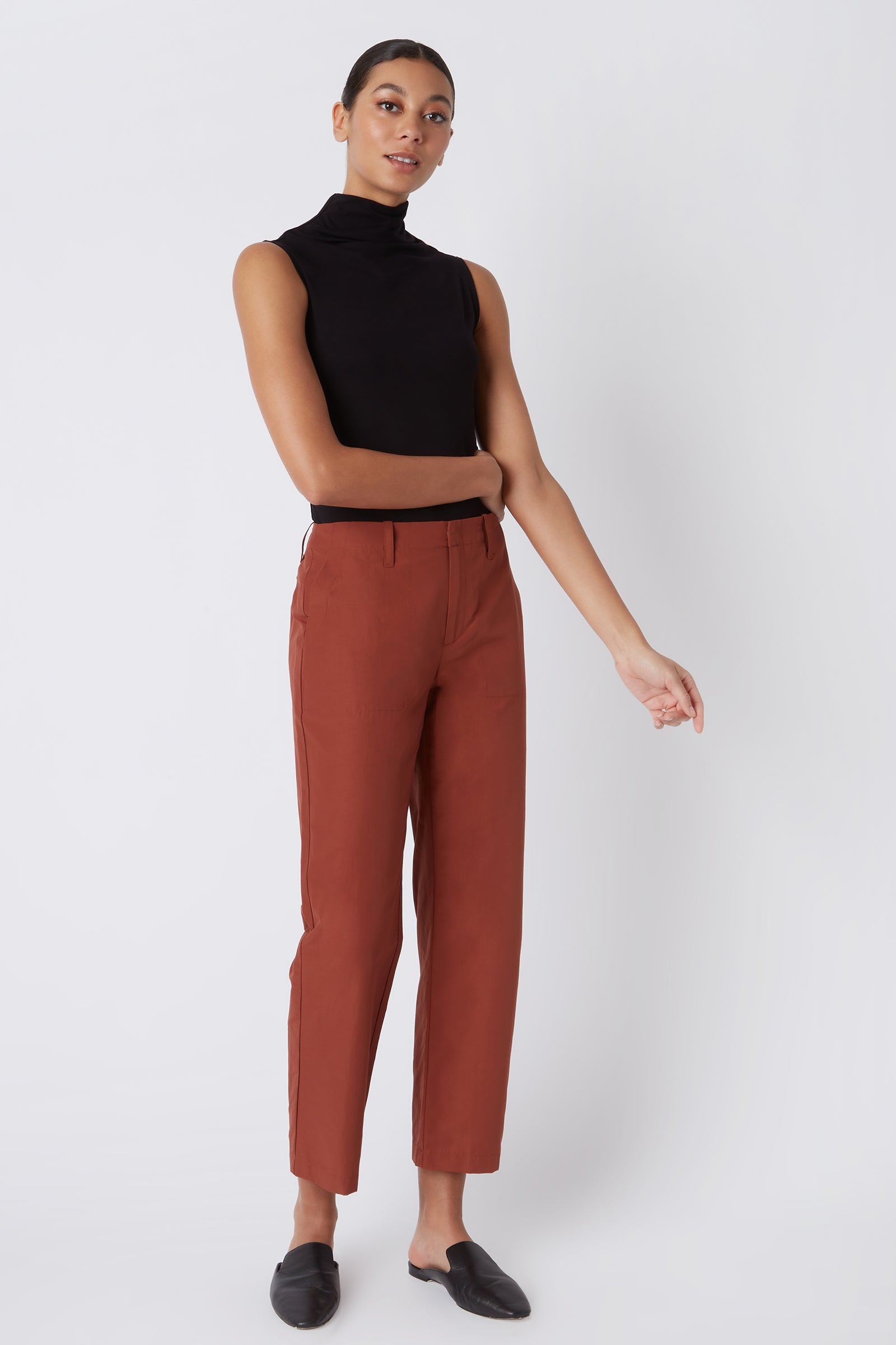 Kal Rieman Francoise Cigarette Pant in Rust Italian Broadcloth on Model with Arm Across Body Full Front Side View