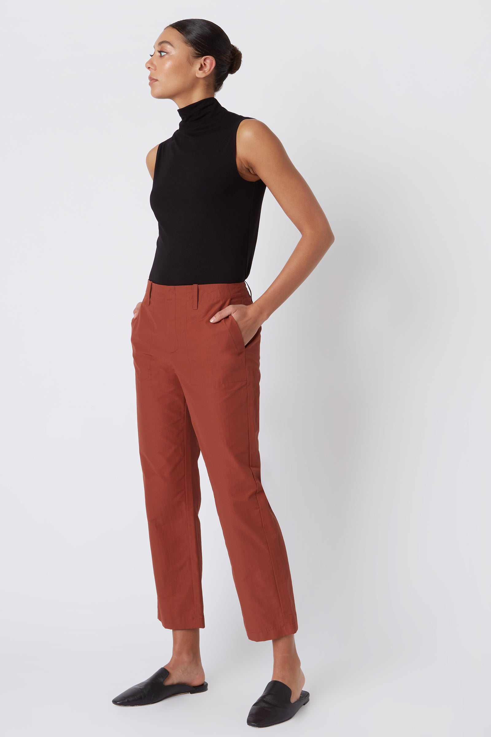 Kal Rieman Francoise Cigarette Pant in Rust Italian Broadcloth on Model with Hands in Pockets Full Side View