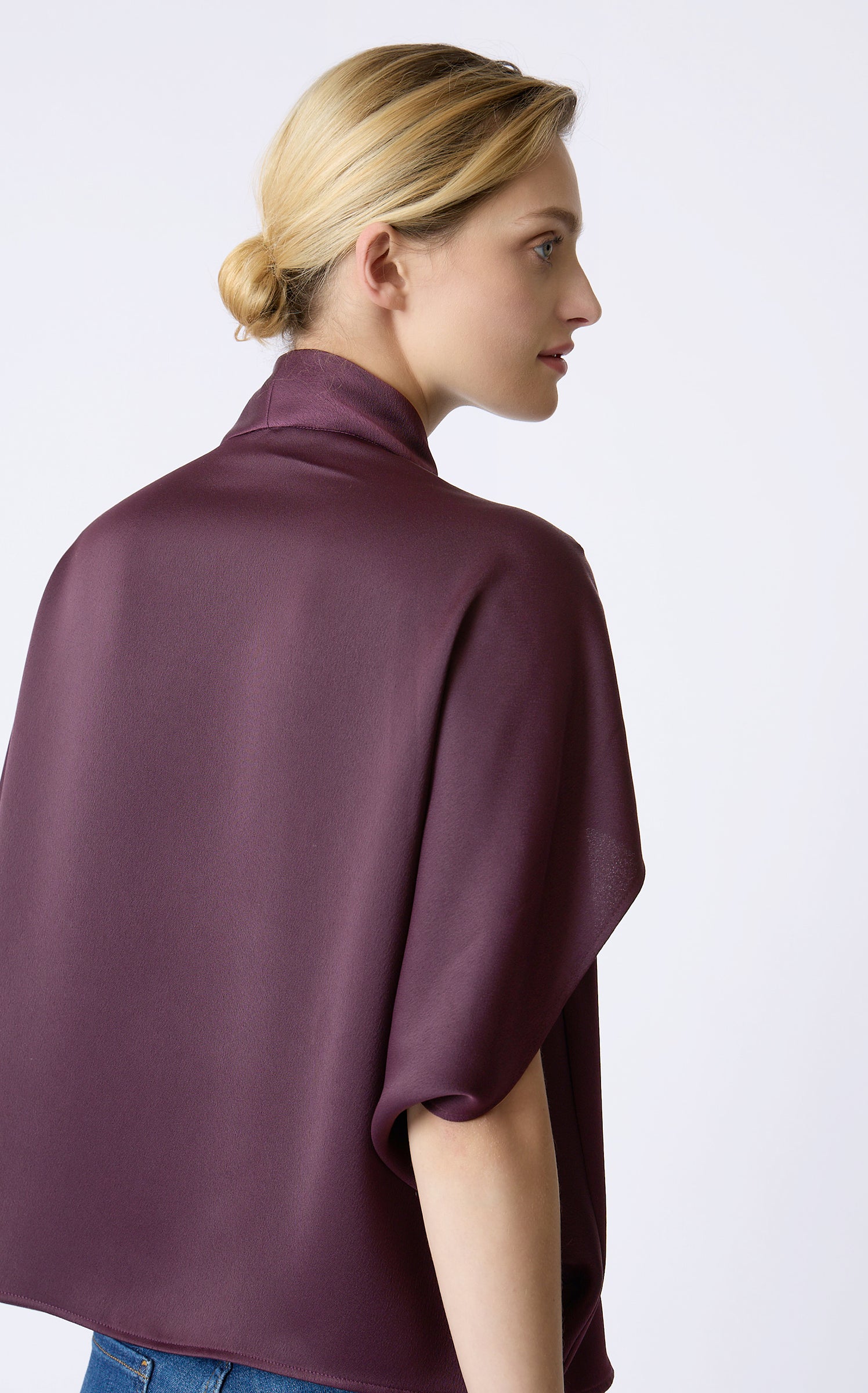 Kal Rieman Angelica Cape Top in Bordeaux on model with right hand in pocket front view