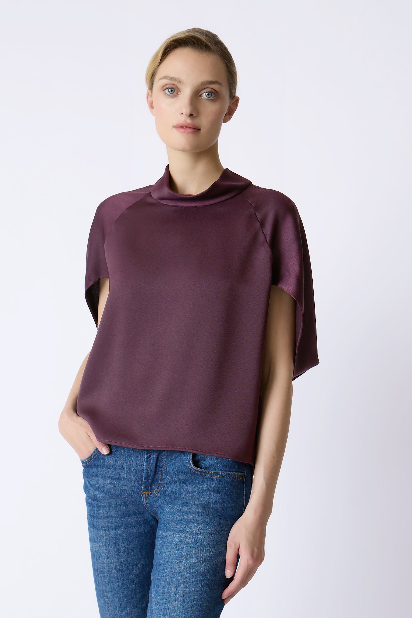 Kal Rieman Angelica Cape Top in Bordeaux on model with right hand in pocket front view