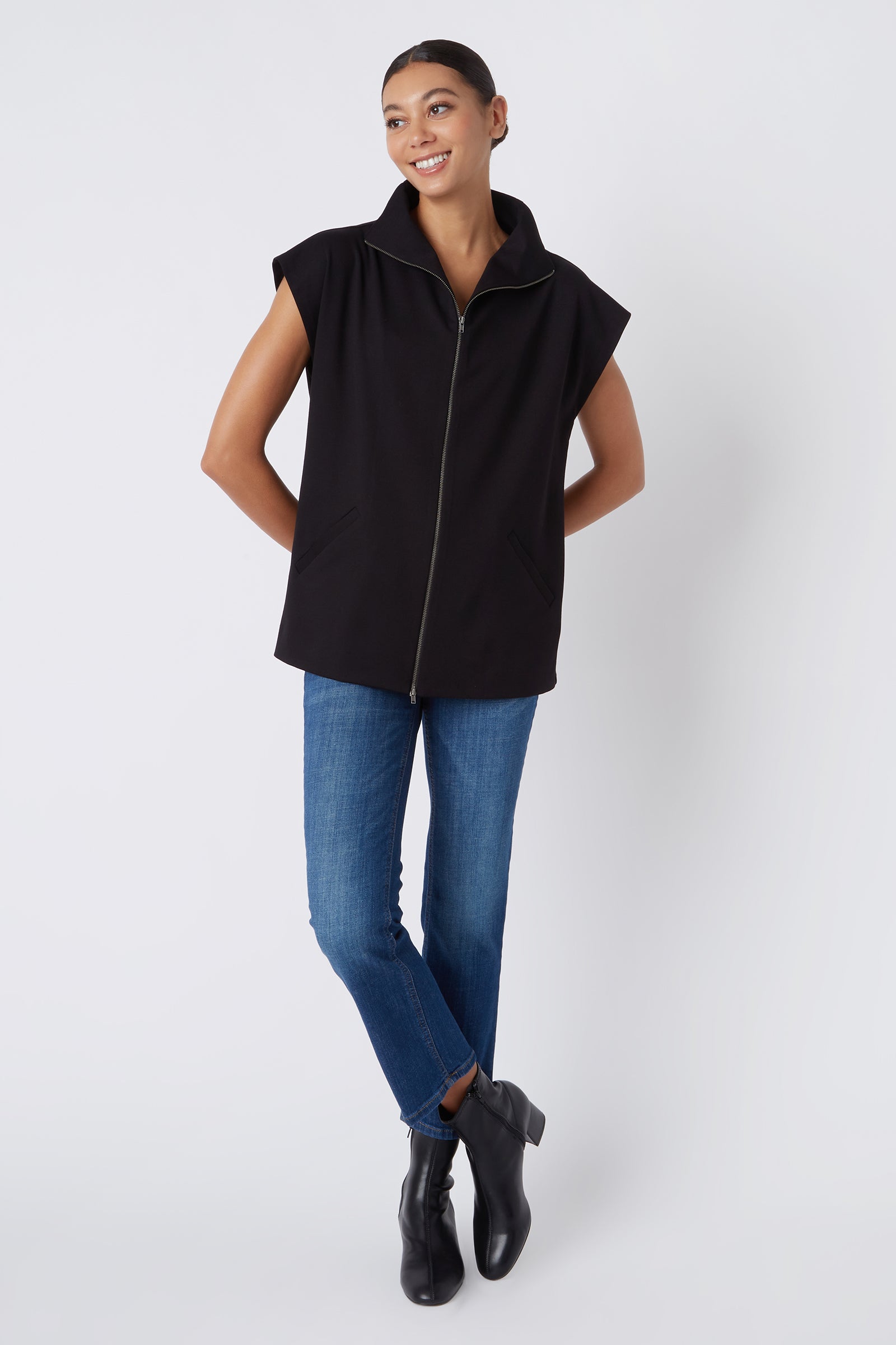Kal Rieman Anne Collared Zip Vest in Black Ponte on Model Smiling with Hands Behind Back Full Front View