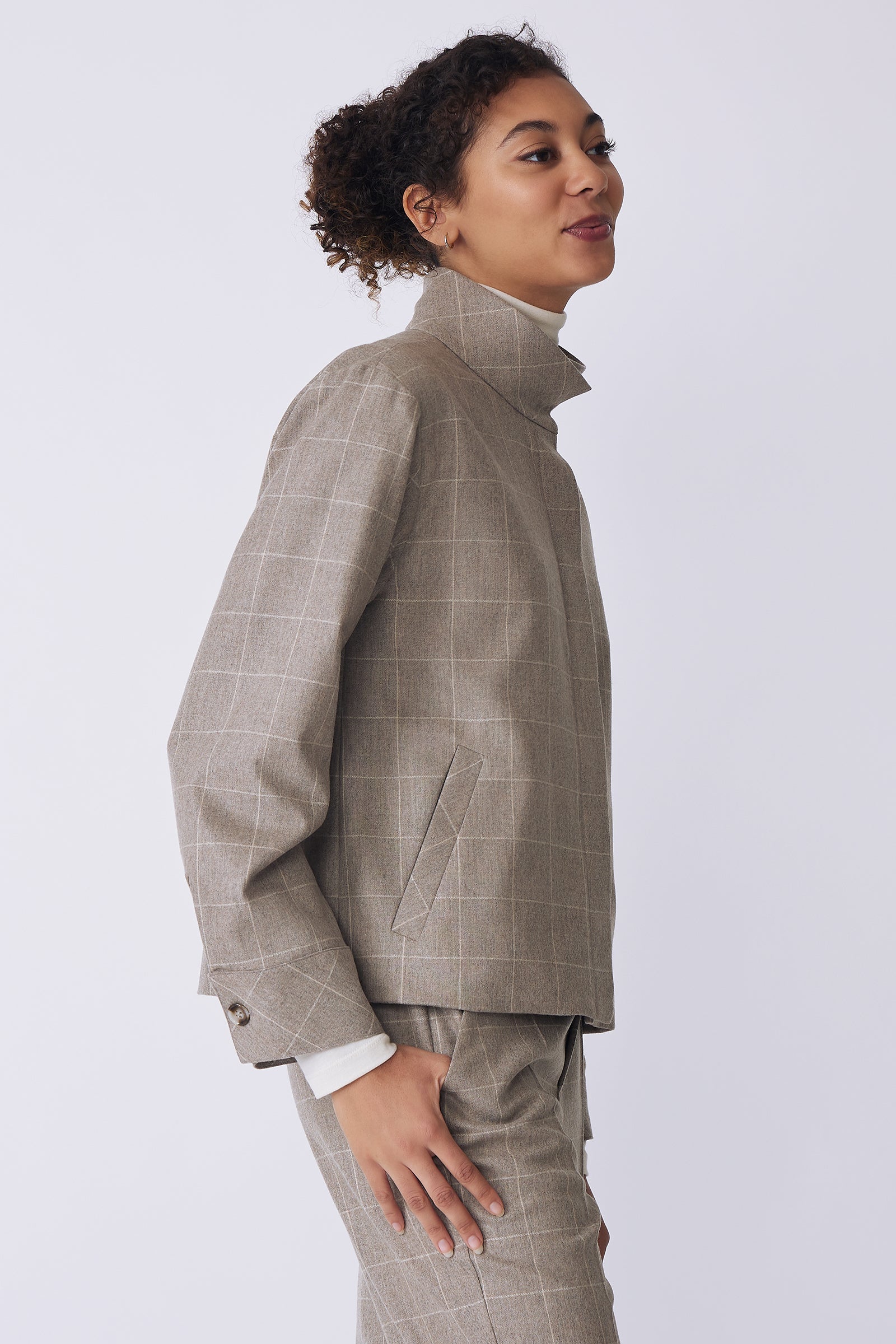 Kal Rieman Ashton Jacket in Italian Windowpane on model side view with hand in pant pocket