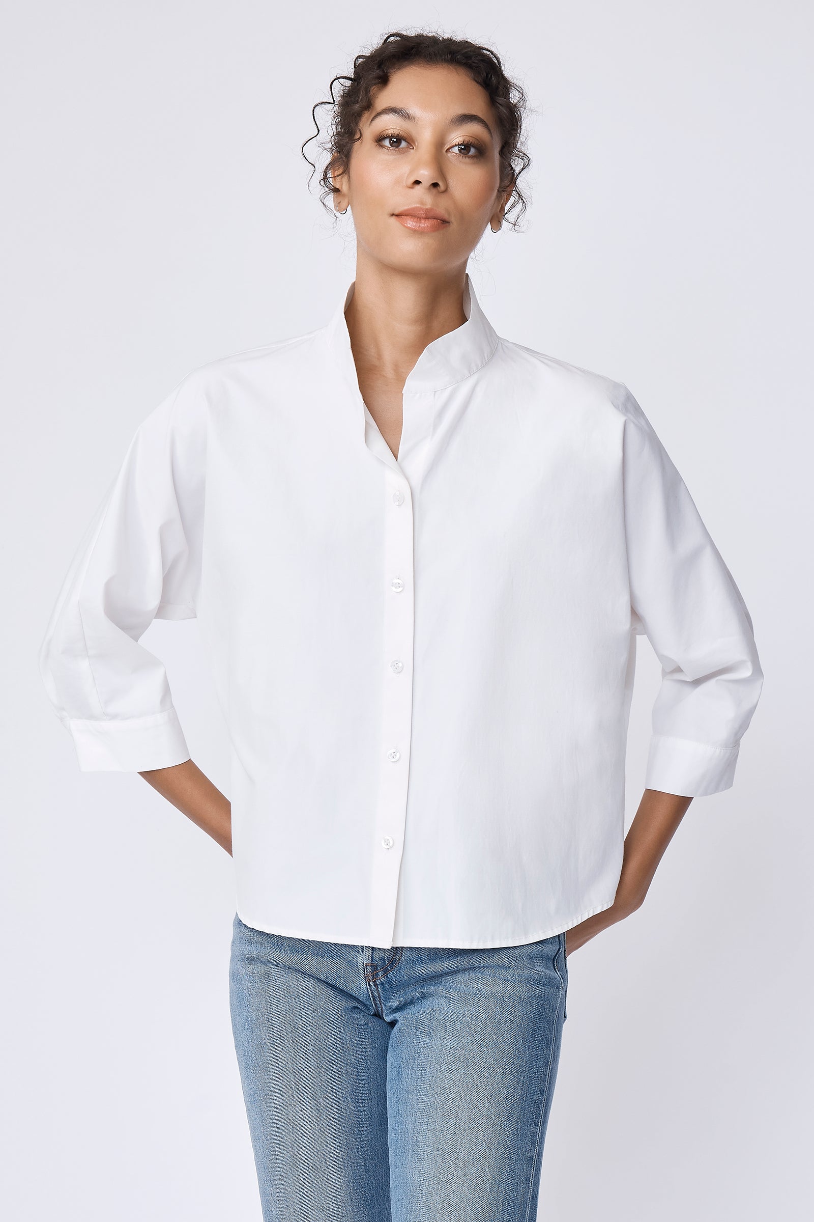 Kal Rieman Avi Shirt in Ecru on model with hands by hips front view