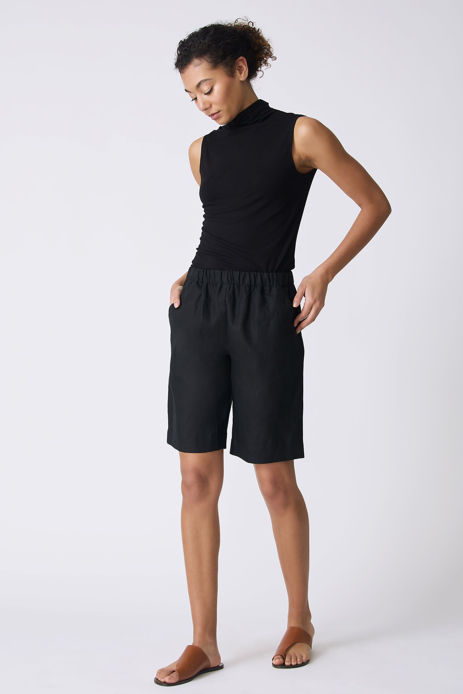 Kal Rieman Bahama Short in Black Linen on model looking down full front view