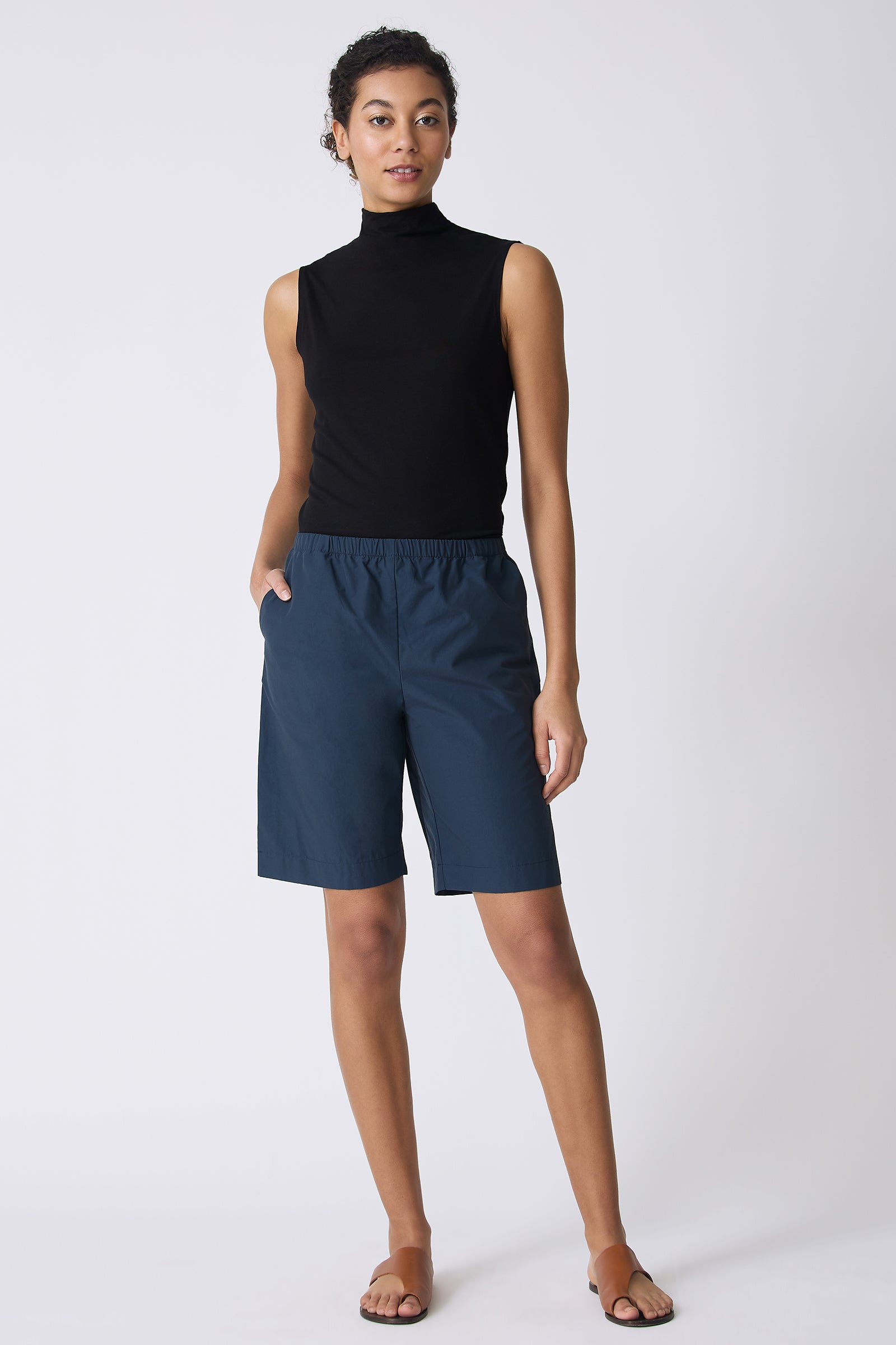 Kal Rieman Bahama Short in Summer Navy on model with hand in pocket full front view