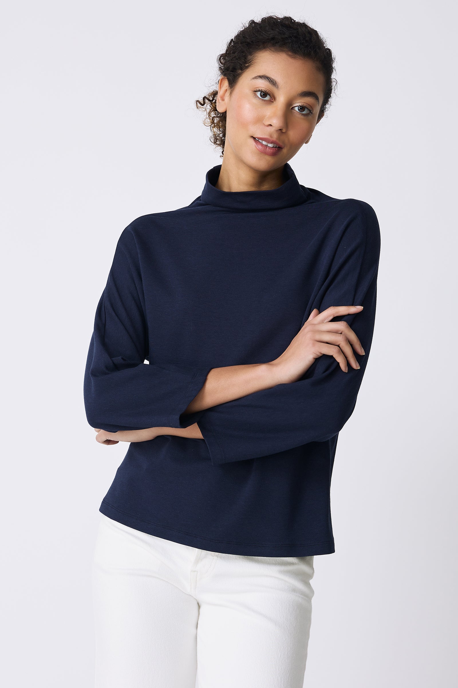 Kal Rieman Brigitte Mock Funnel in Navy on model with arms crossed front view