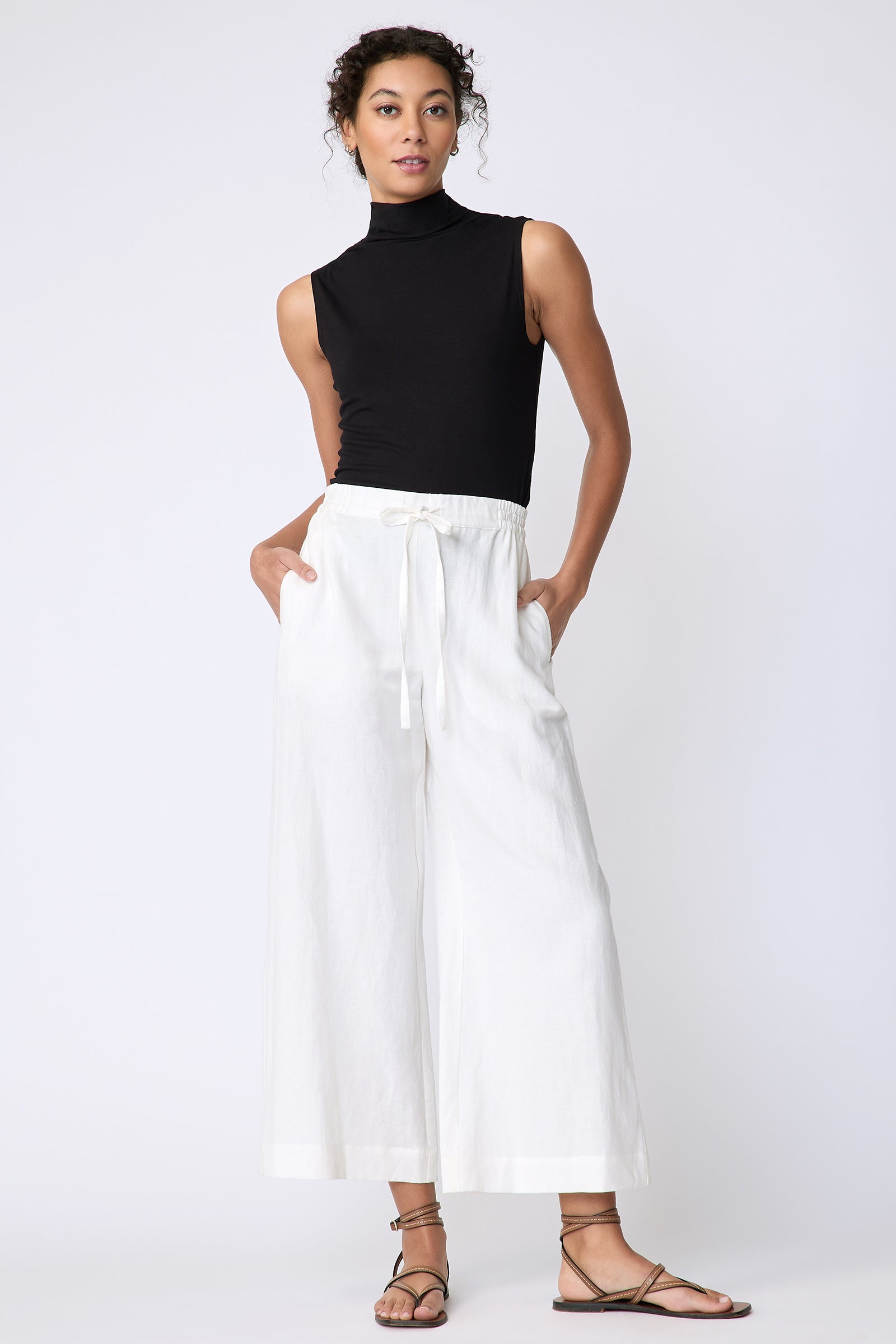 Kal Rieman Celeste Pant in Ecru Cotton linen on model front view hands in pockets