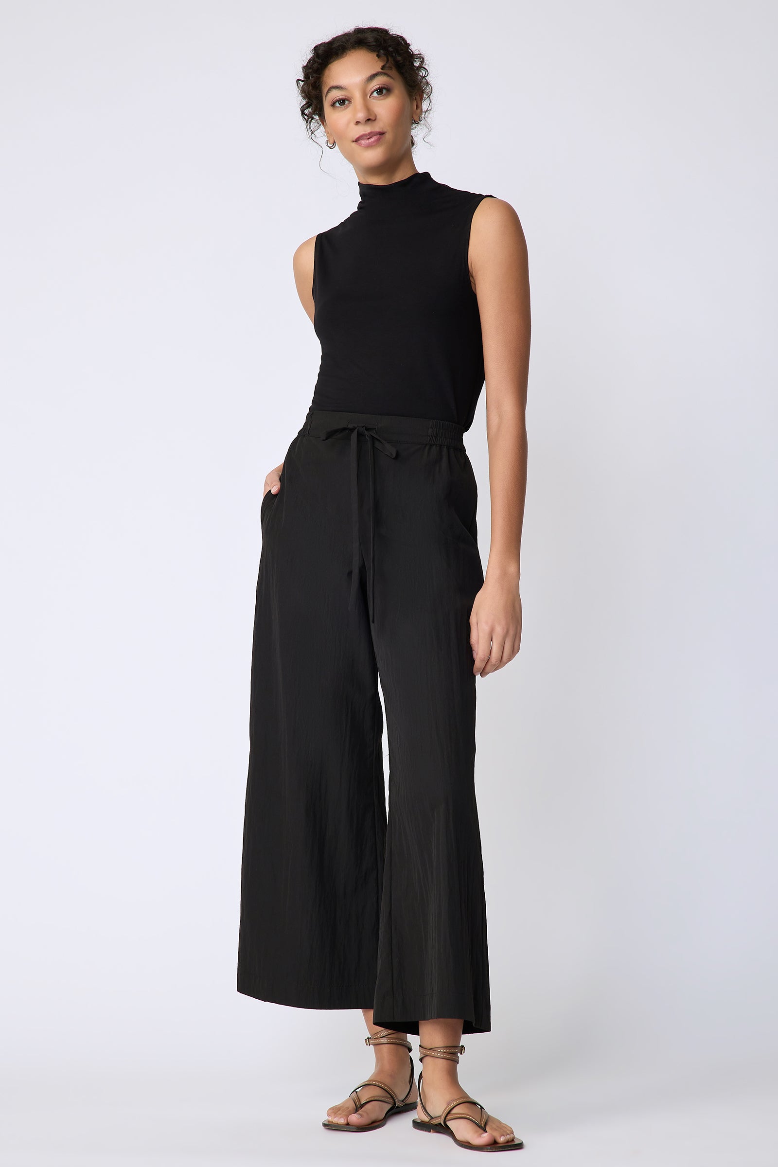 Kal Rieman Celeste Pant in black typewriter cloth on model front view hand in pocket full length