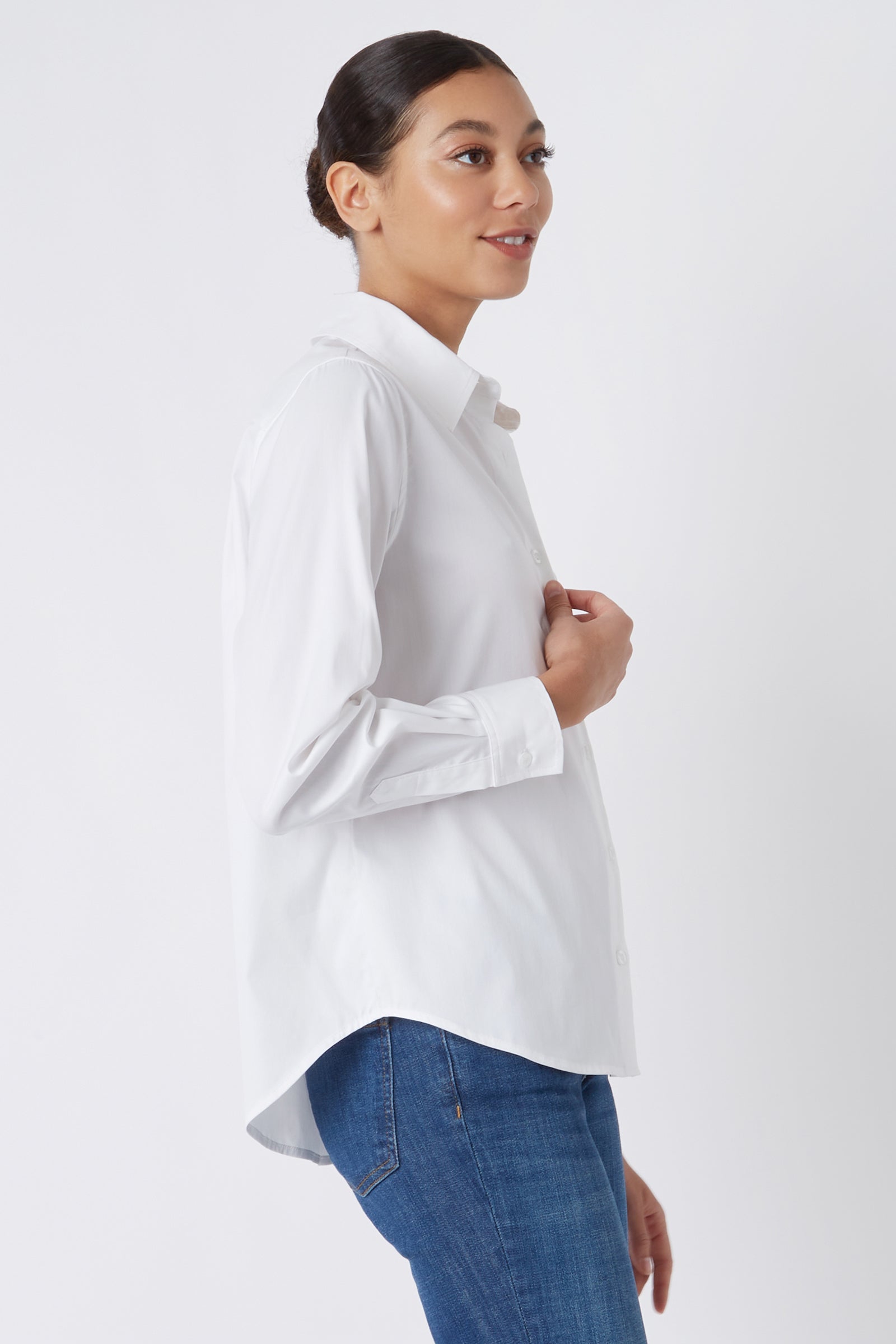 Kal Rieman Classic Tailored Shirt in White Pinpoint Oxford on Model Touching Shirt Cropped Side View