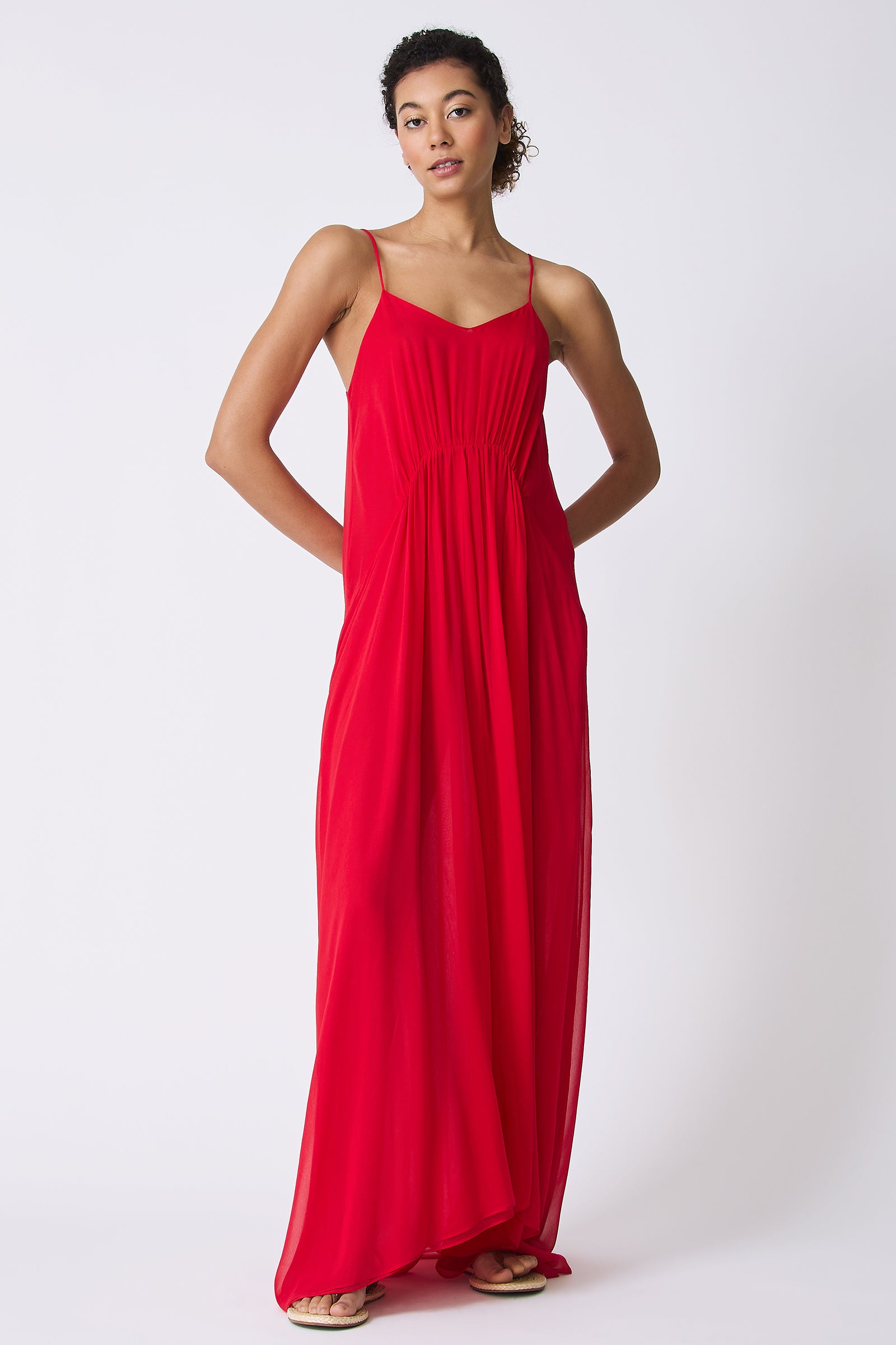 Kal Rieman Cora Shirred Maxi Dress in Red on model with hands behind back full front view