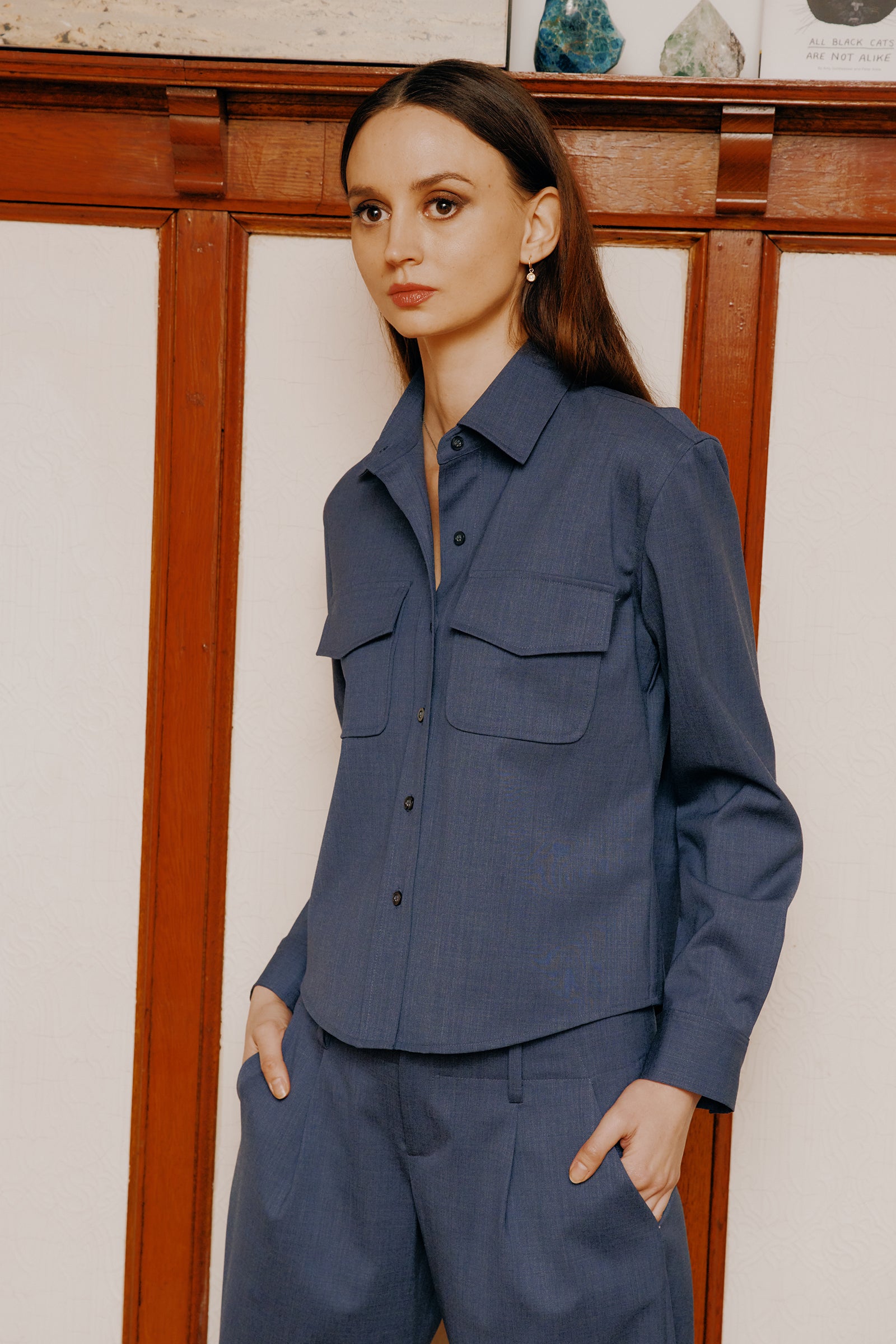 Kal Rieman Crop Tailored Shirt in denim suiting on model front view holding cuff