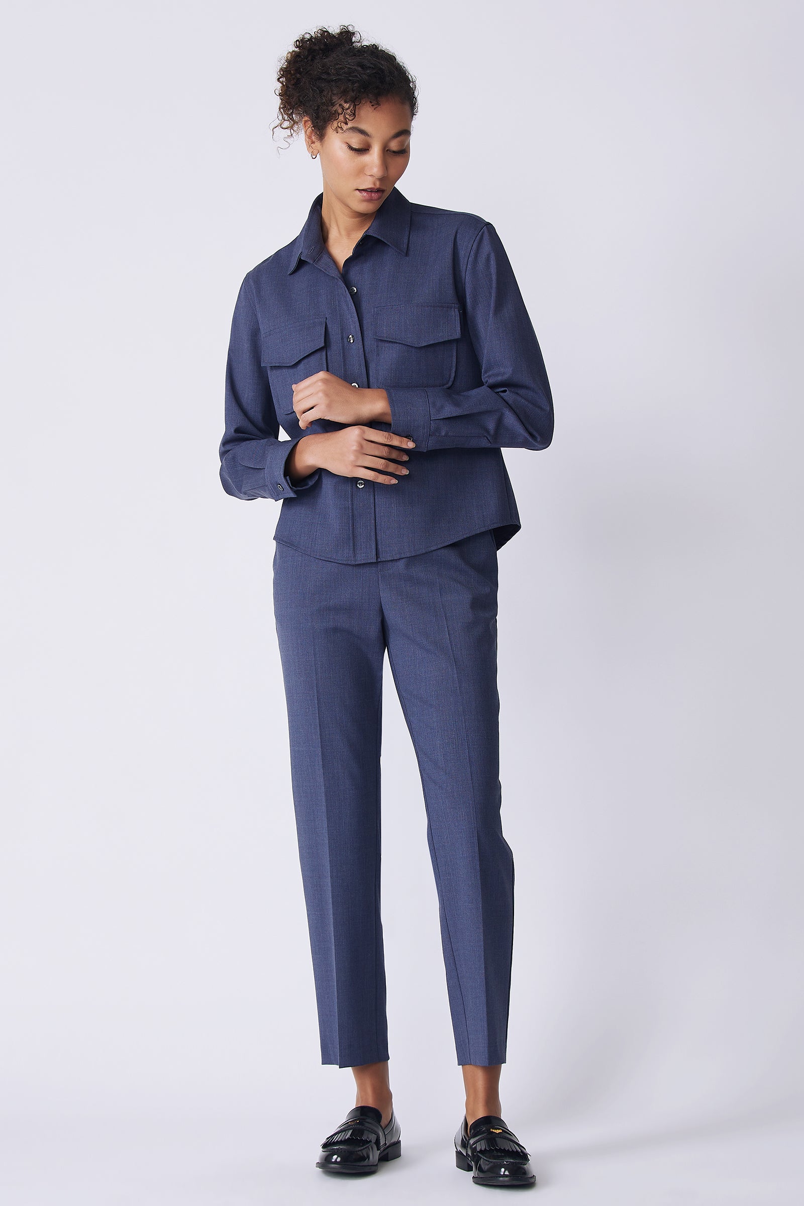 Kal Rieman Crop Tailored Shirt in denim suiting on model front view holding cuff