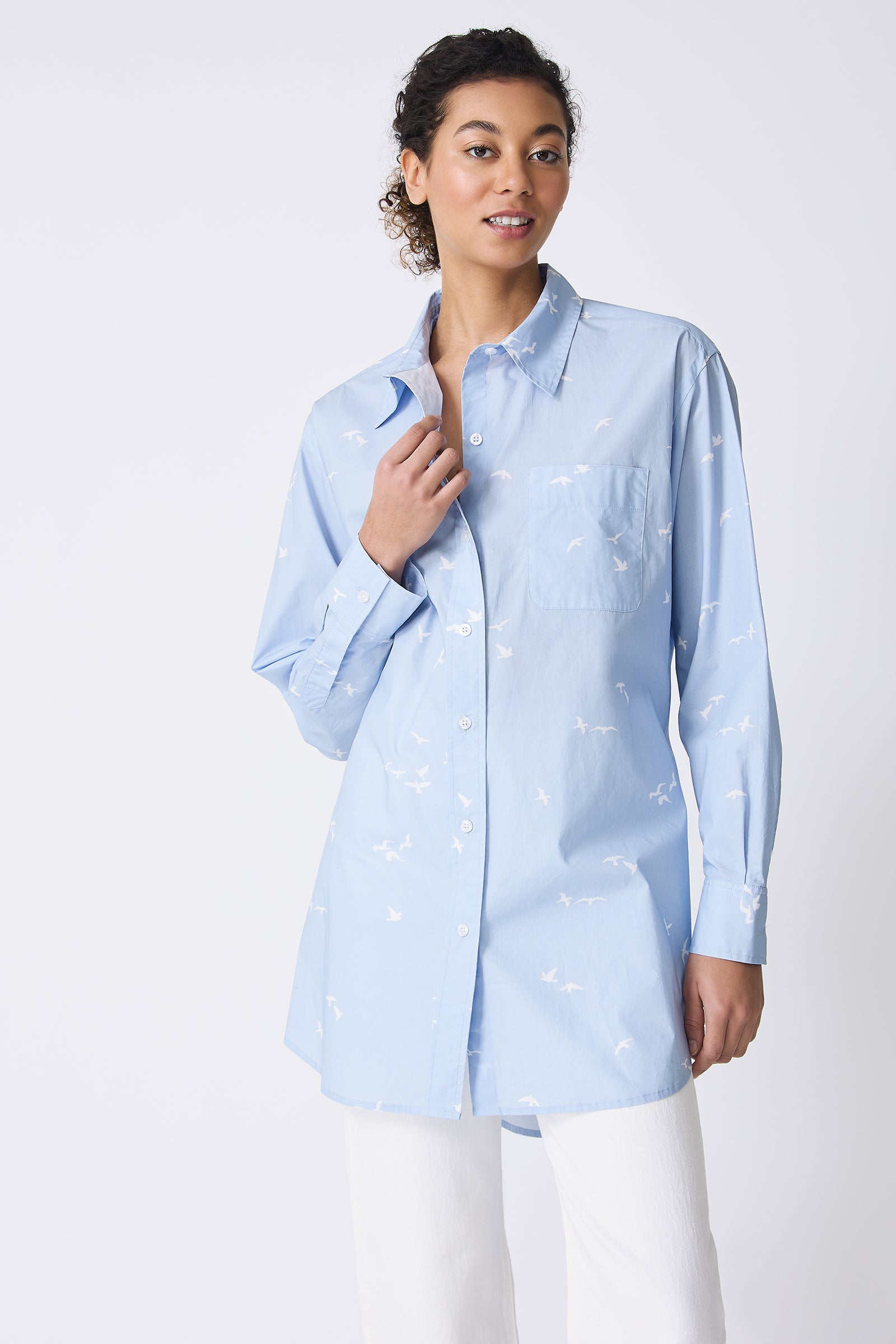 Kal Rieman Deanna Shirt in Oxford Blue Bird Print on model touching button front view