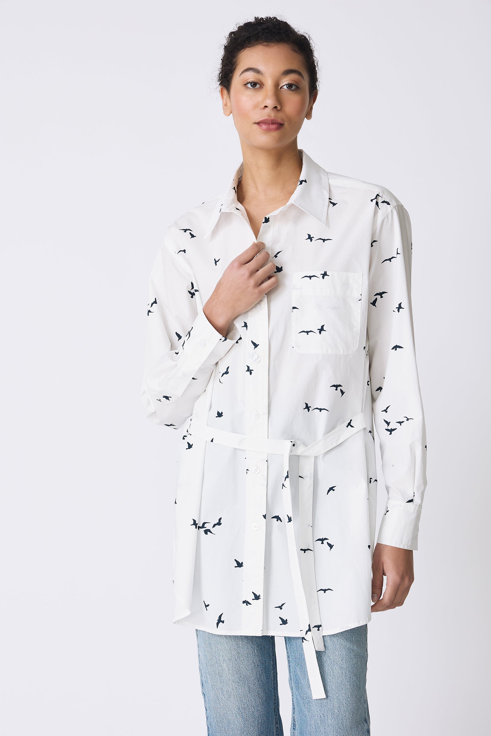 Kal Rieman Deanna Shirt in White Bird Print on model touching button front view