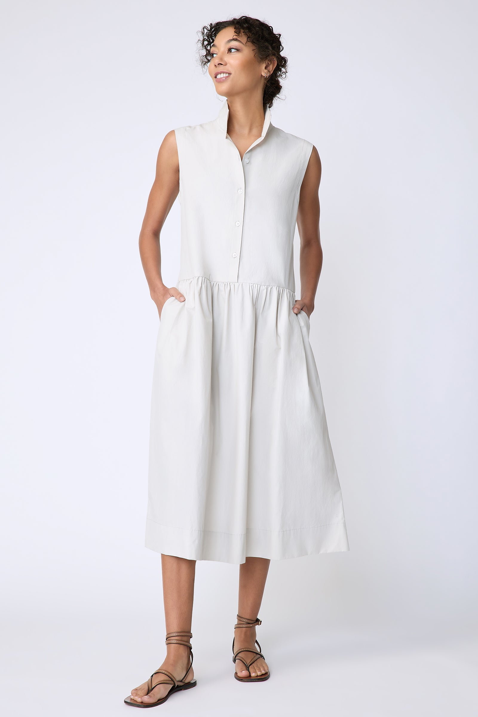 Kal Rieman Demi Dress in Italian  Broadcloth stone color on model front view hands in pockets