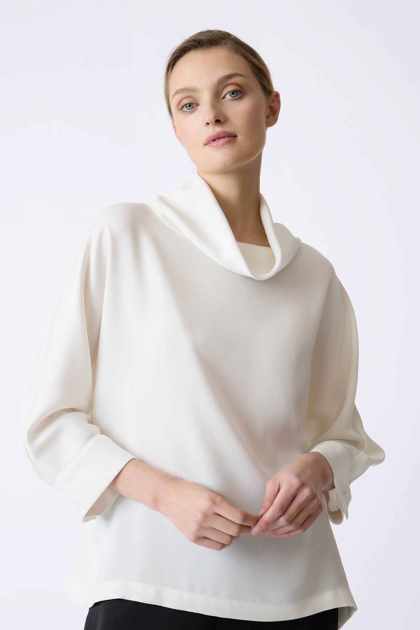 Kal Rieman Ellie Satin Tneck in Ivory on model with hands together front view