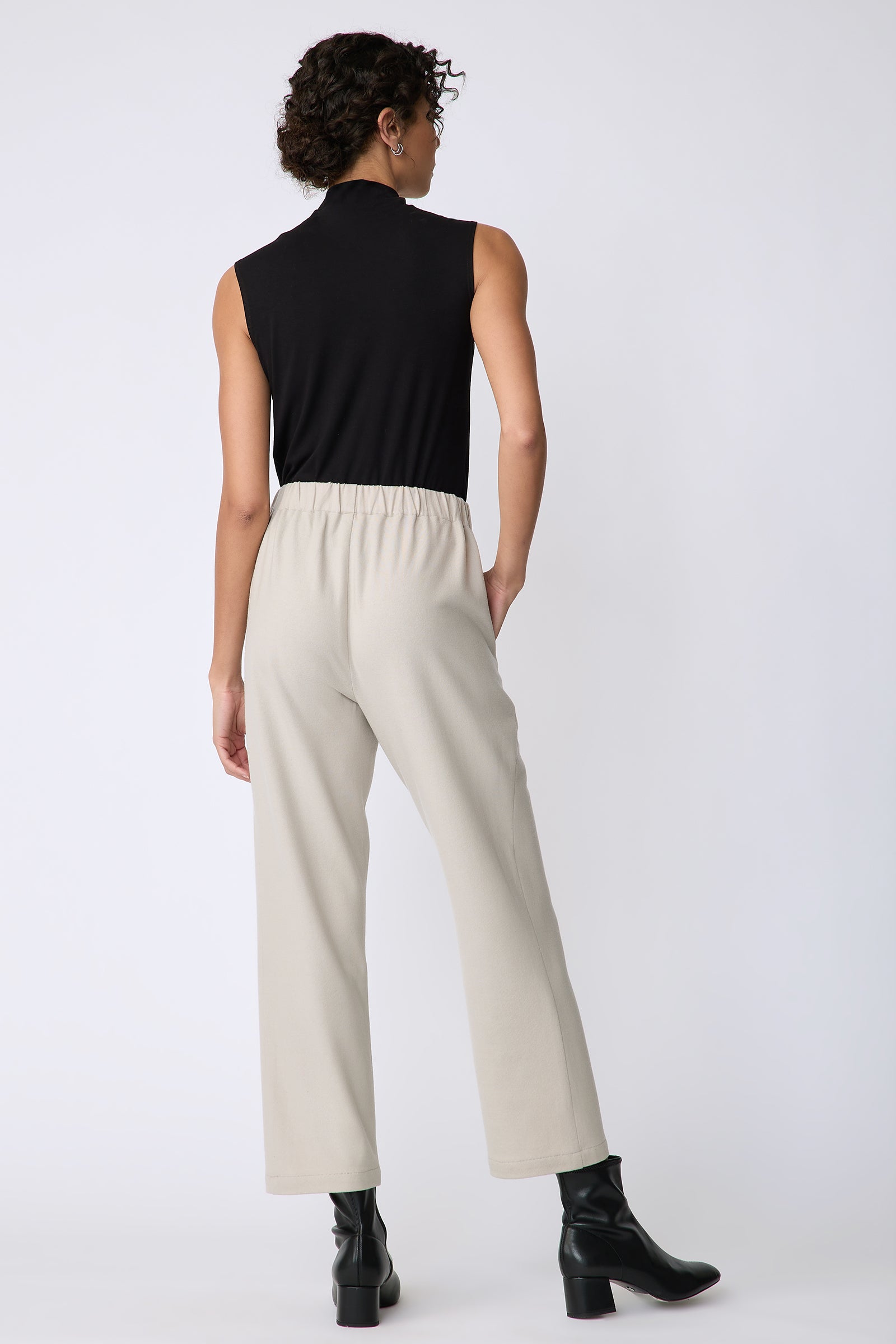 Kal Rieman Felted Jersey Angle seam crop pant in mink on model front view hands in pockets 