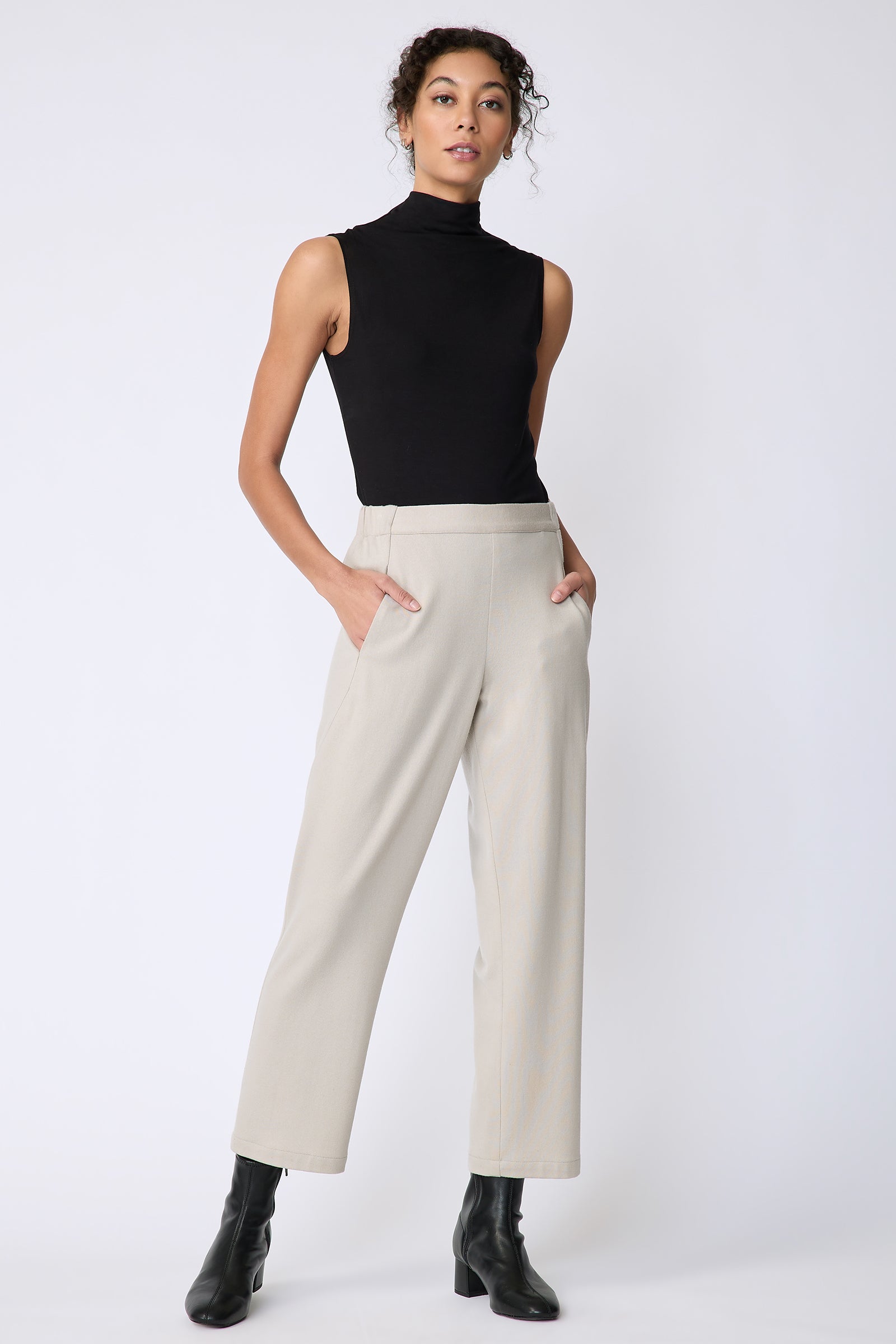 Kal Rieman Felted Jersey Angle seam crop pant in mink on model front view hands in pockets 