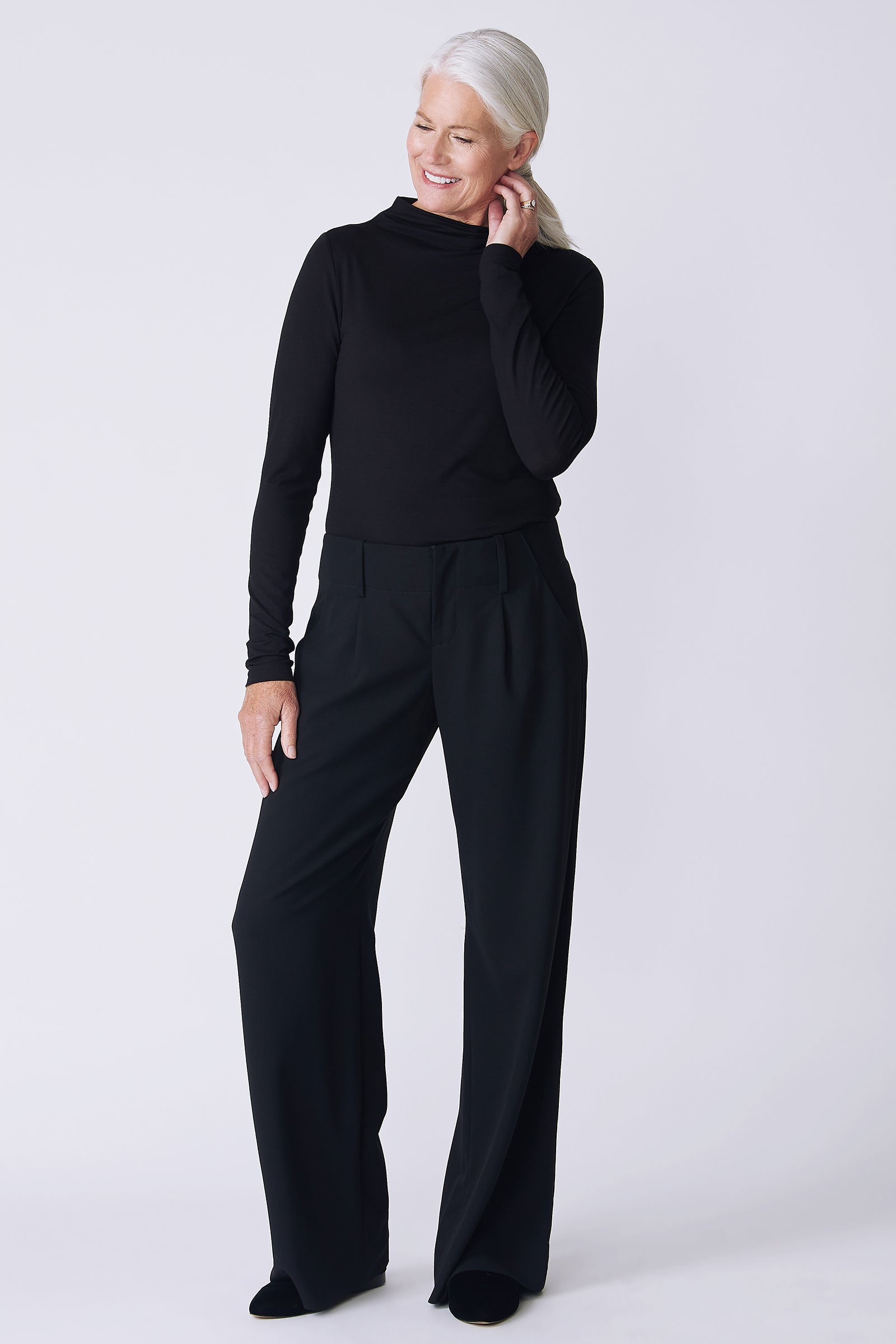 Kal Rieman Gabby Trouser in black on model front view hand on ear