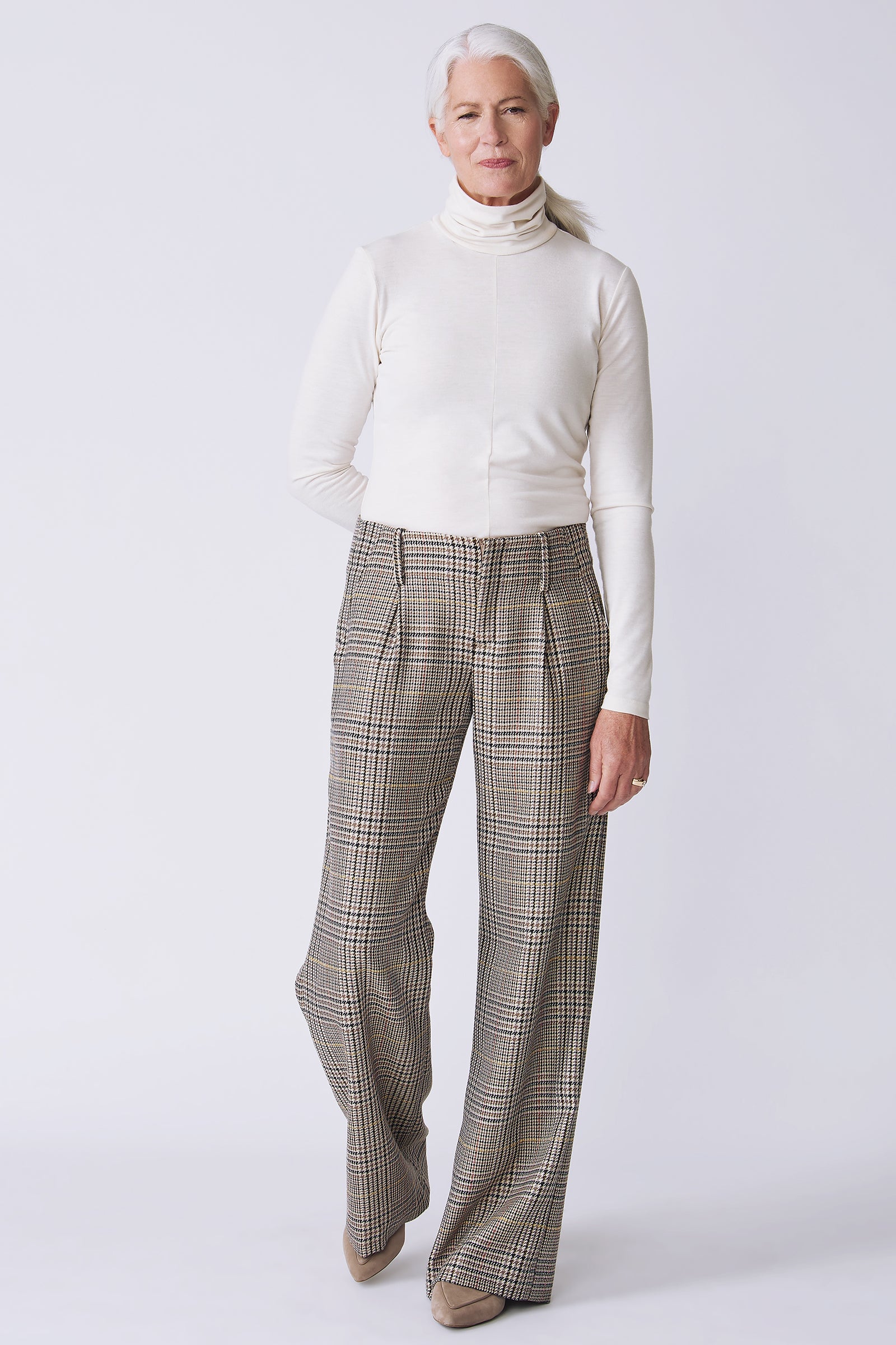 Kal Rieman Gabby Trouser in plaid on model front view full walking with hand behind back