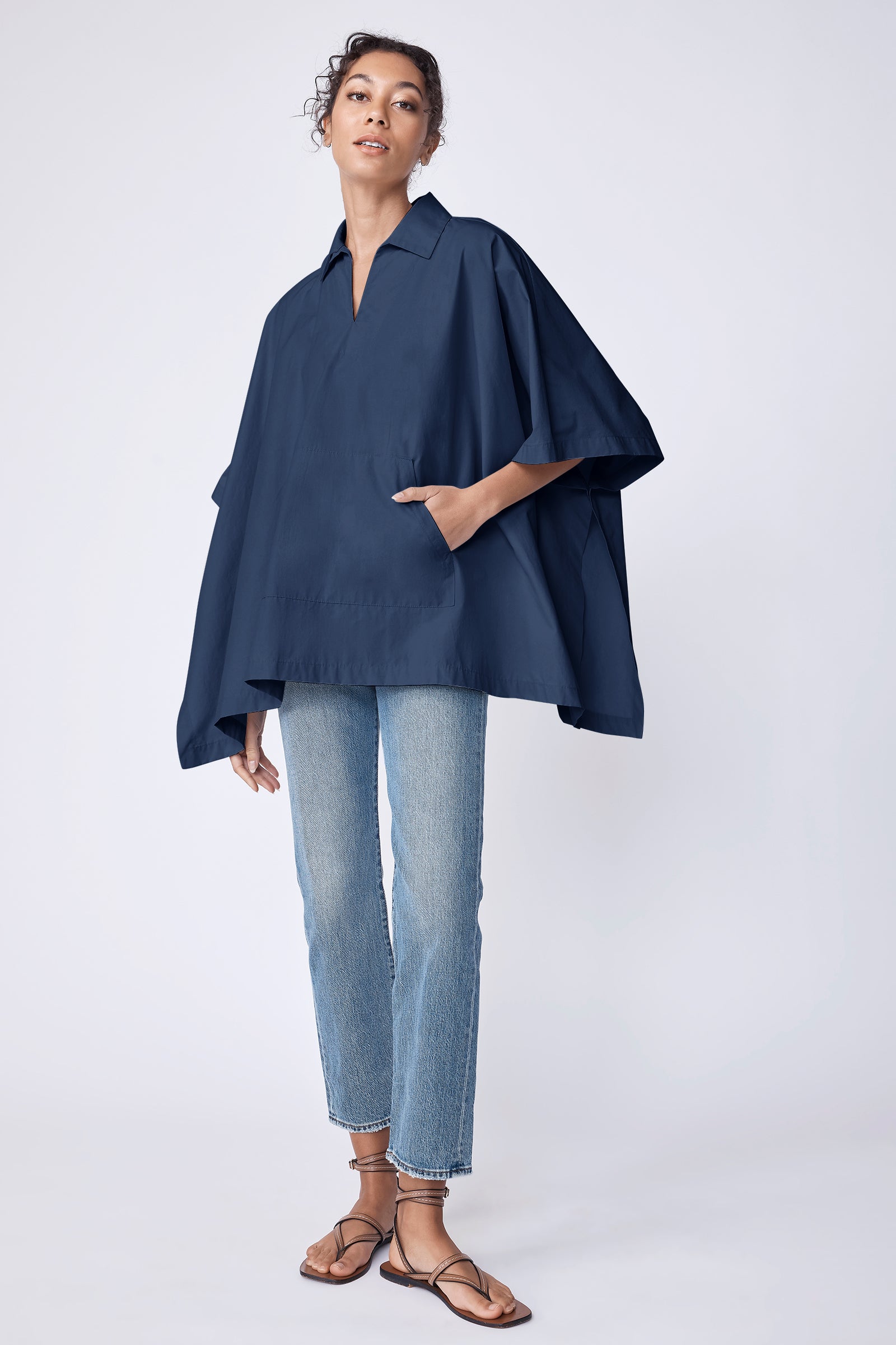 Kal Rieman Gene Pocket Poncho in summer navy Italian broadcloth on model with hand in pocket full front view