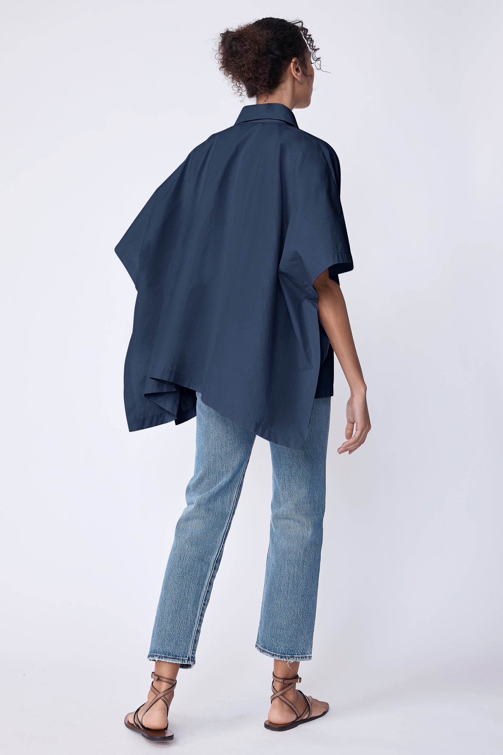 Kal Rieman Gene Pocket Poncho in summer navy Italian broadcloth on model with hand in pocket full front view
