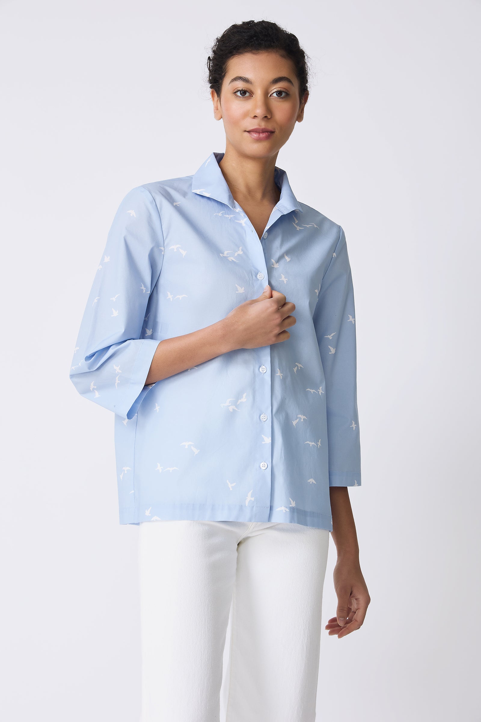 Kal Rieman 3/4 Sleeve Ginna Shirt in Oxford Blue Bird Print on model touching shirt front view