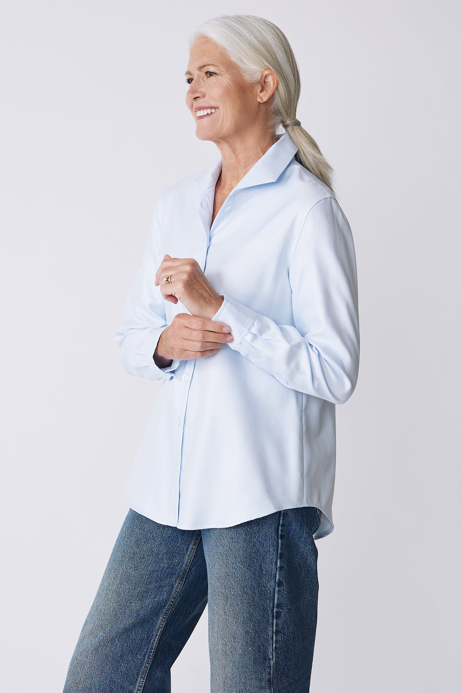 Kal Rieman Ginna Box Pleat Shirt in French Blue Herringbone on Model Side View holding cuff