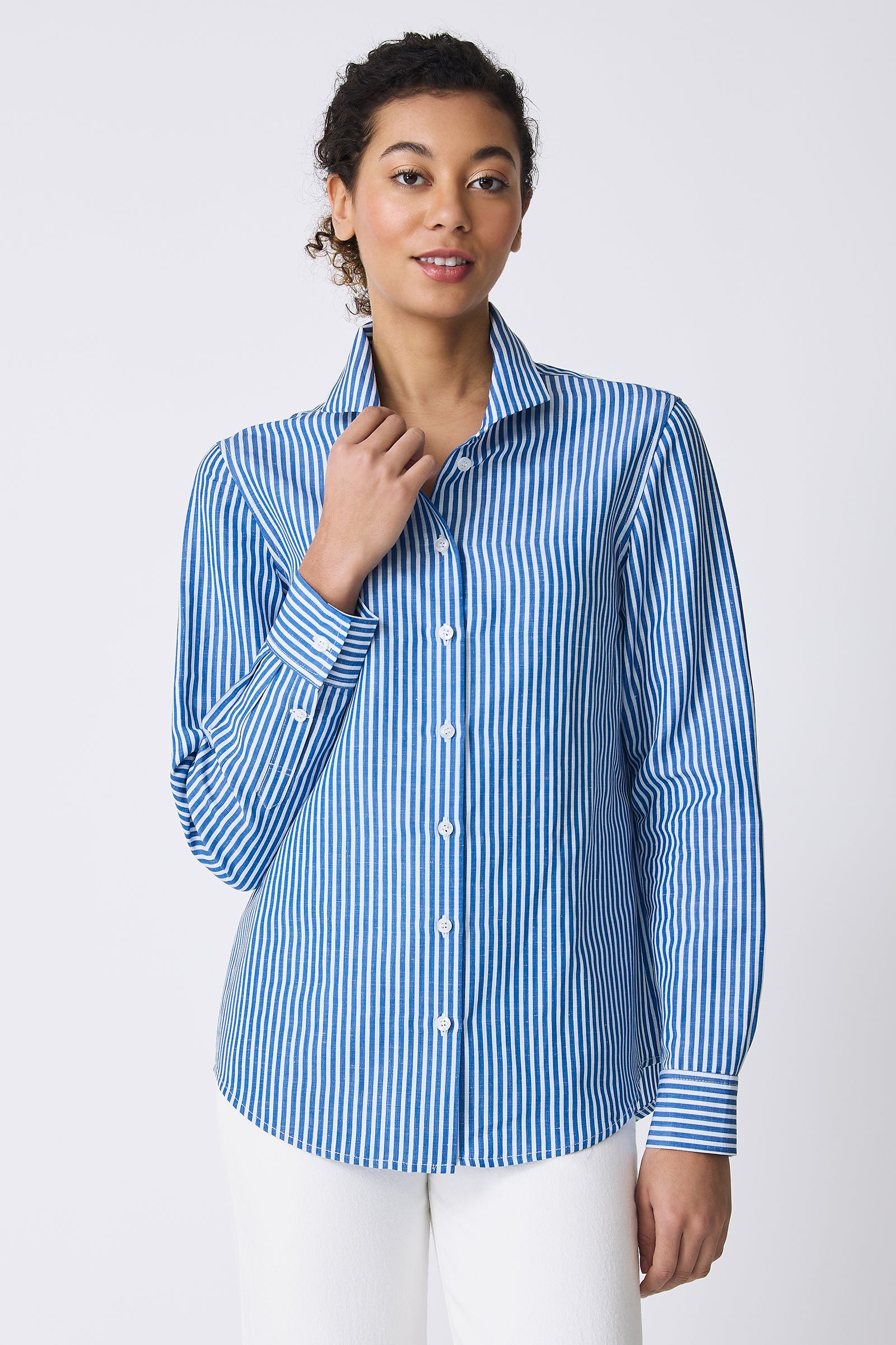 Kal Rieman Ginna Box Pleat Shirt in Cabana Stripe Blue on model touching shirt front view