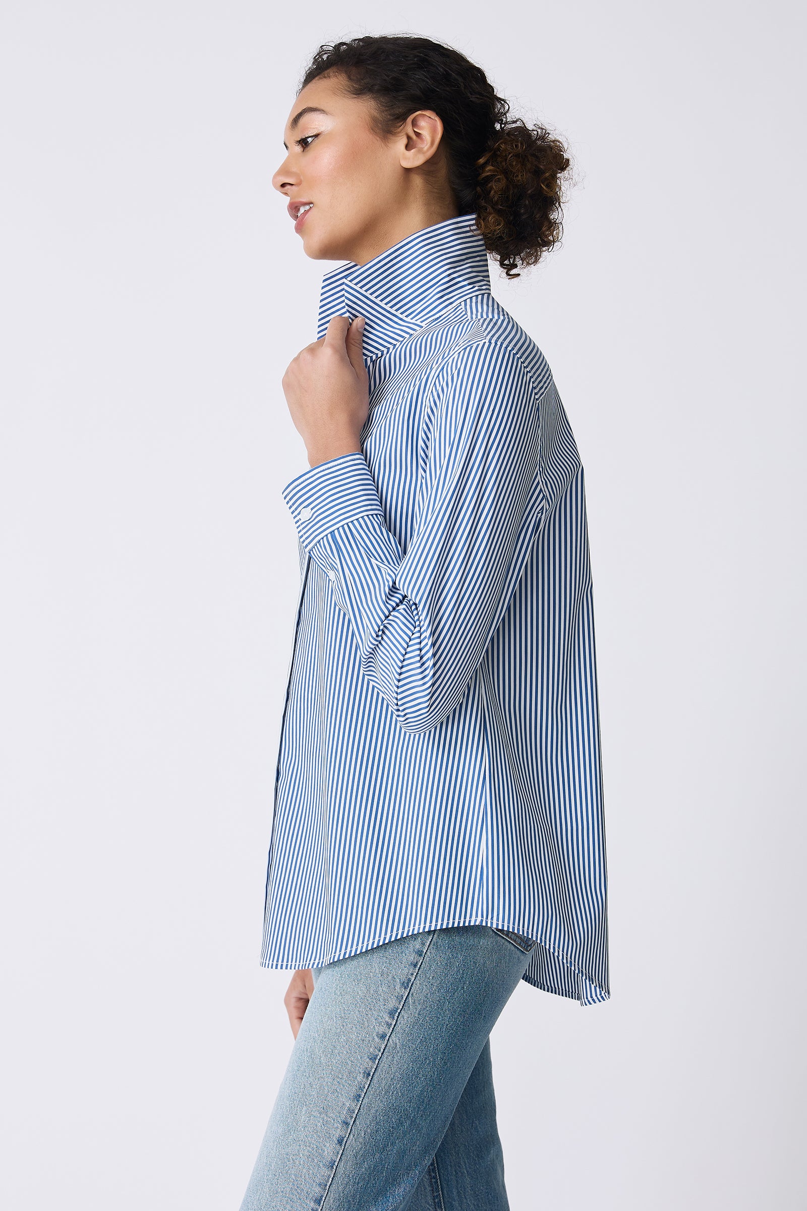 Kal Rieman image of the Ginna Box Pleat Shirt in Miami Stripe Blue on model side view