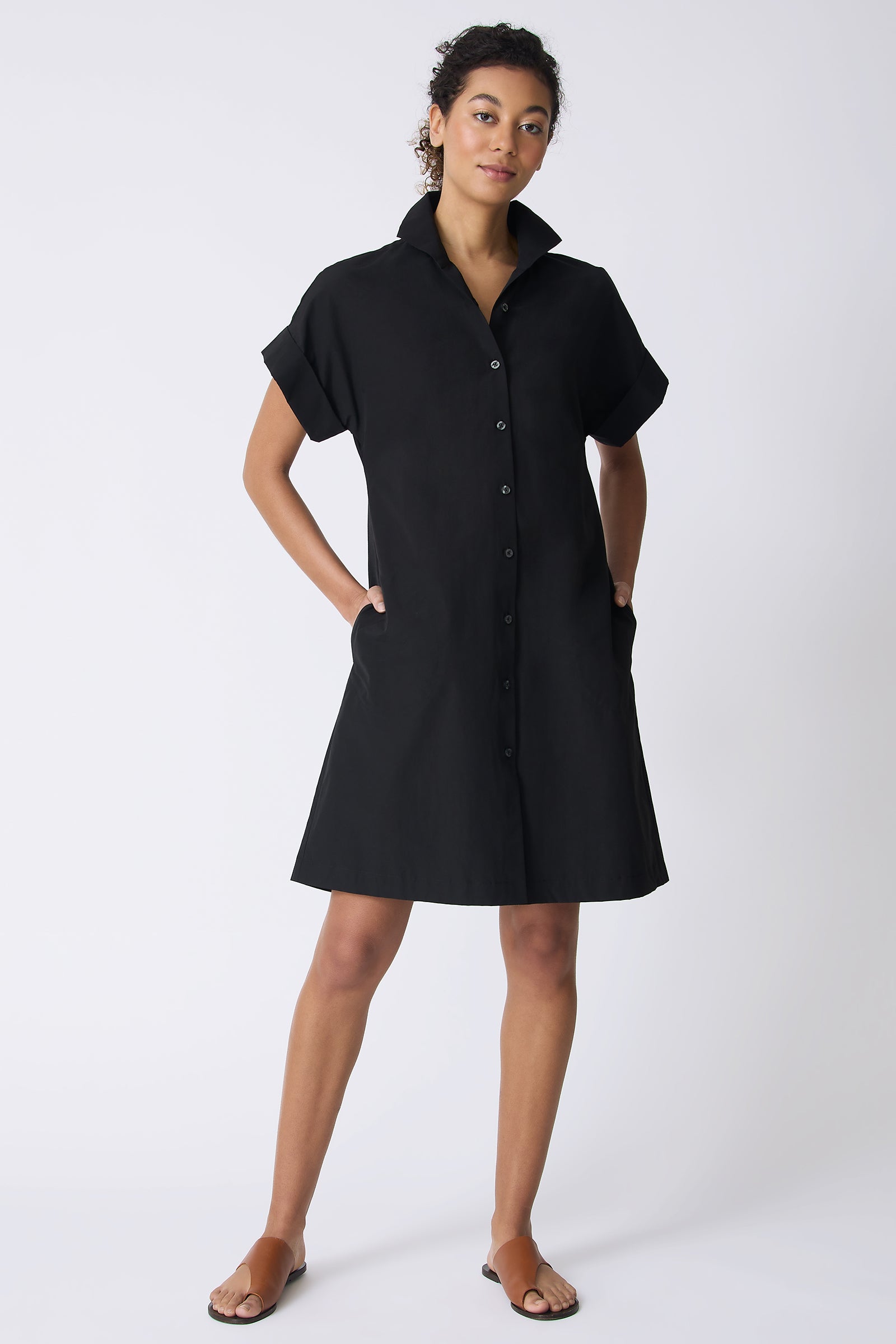 Kal Rieman Holly Kimono Dress in Black on model with hands in pockets full front view