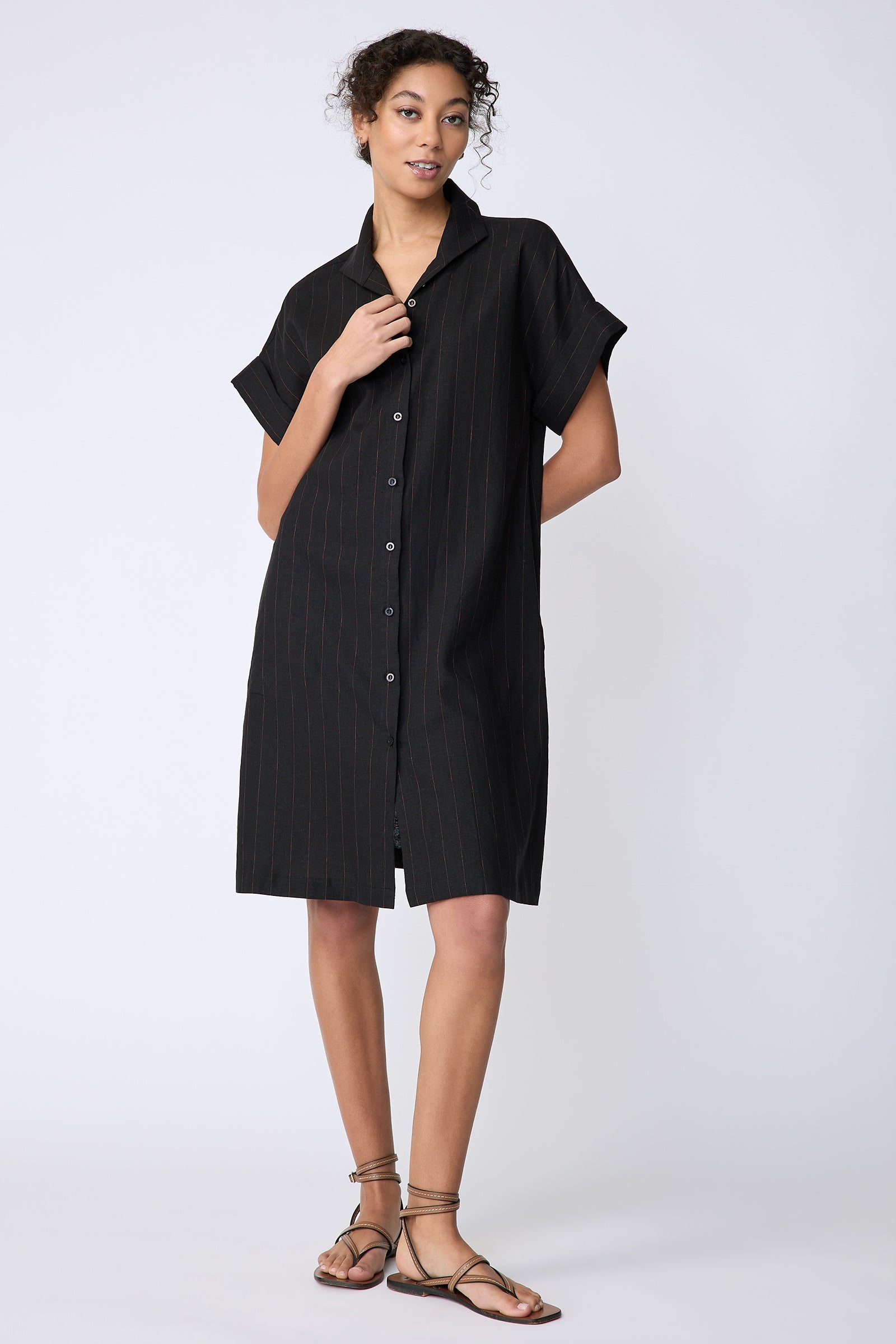 Kal Rieman Holly Kimono Dress in black pinstripe linen on model front view hand behind back