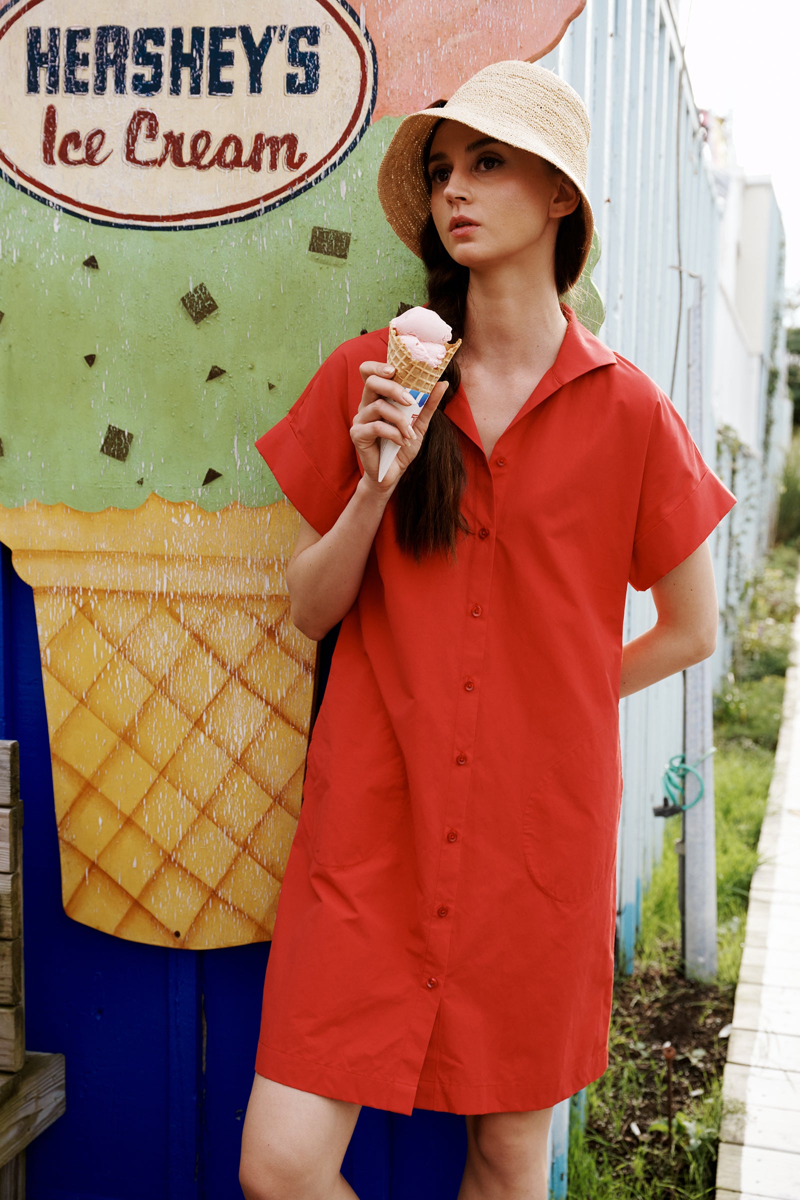 Kal Rieman Holly Kimono dress in red broadcloth on model eating ice cream