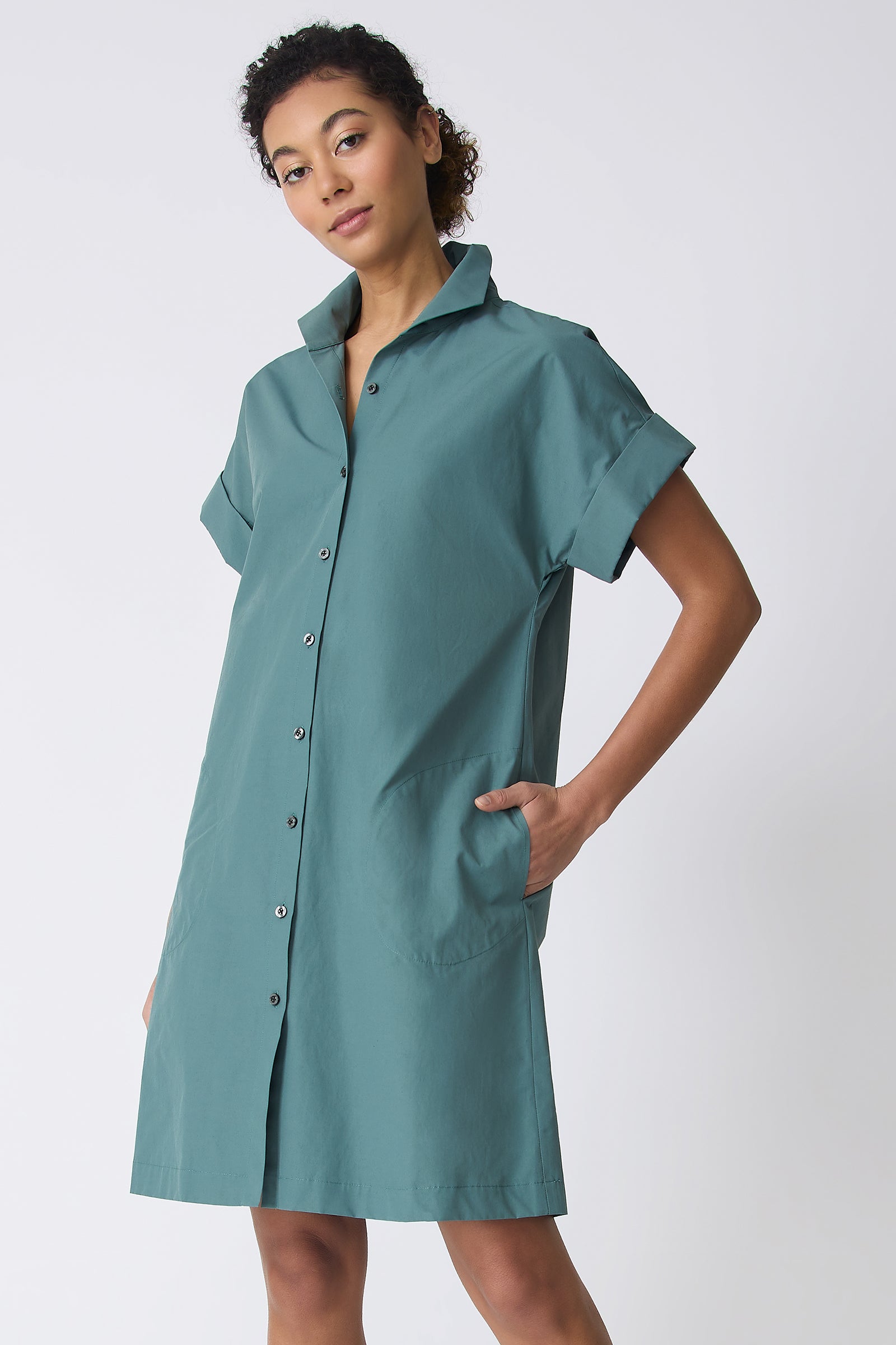 Kal Rieman Holly Kimono Dress in Sage on model with hand in pocket front view