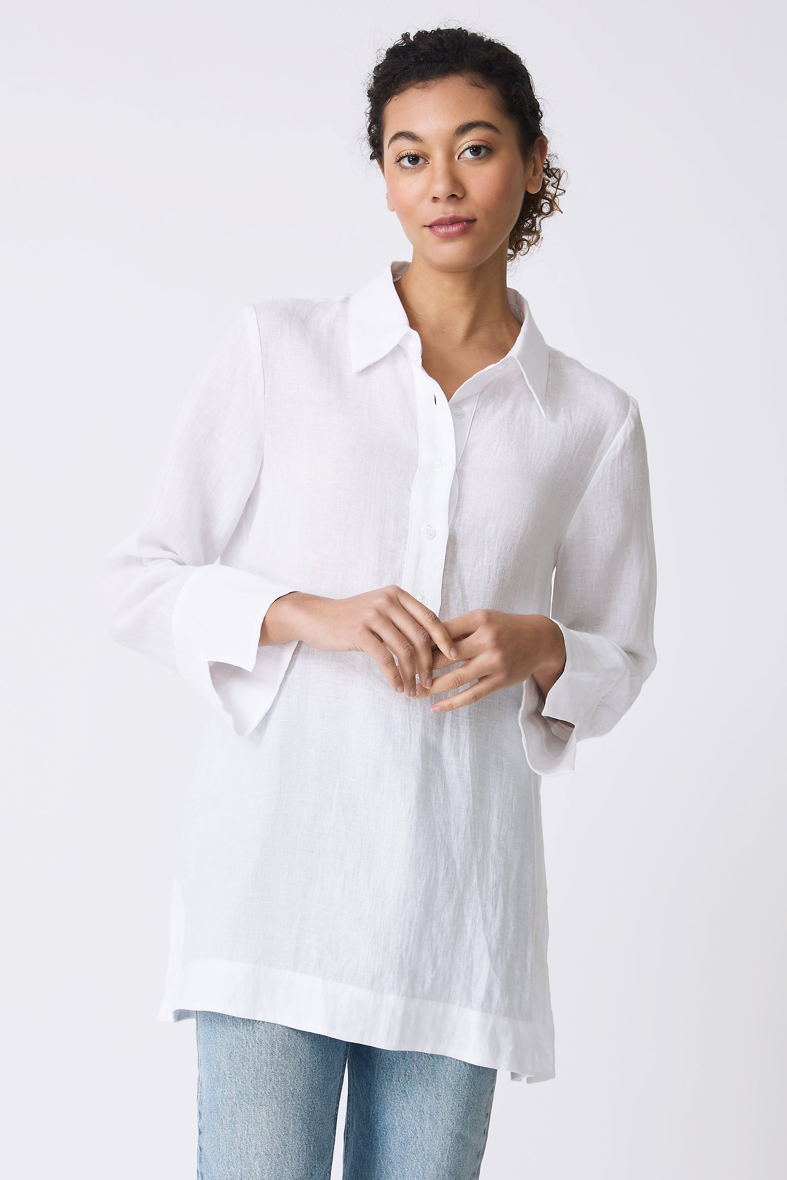 Kal Rieman Inez Placket Tunic in White on model with hands in front of body front view