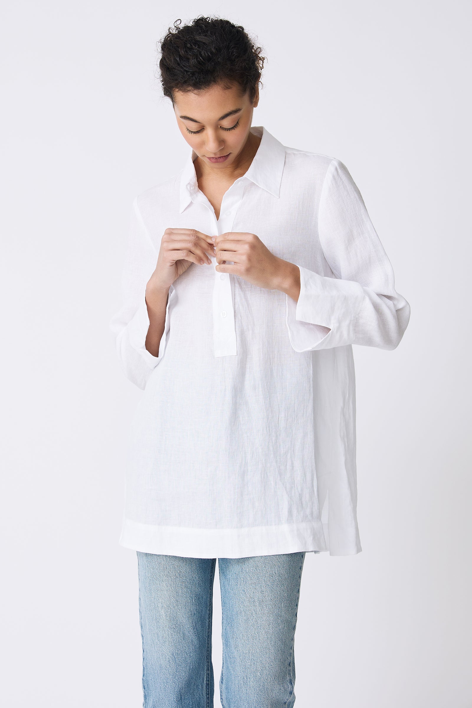 Kal Rieman Inez Placket Tunic in White on model buttoning shirt front view
