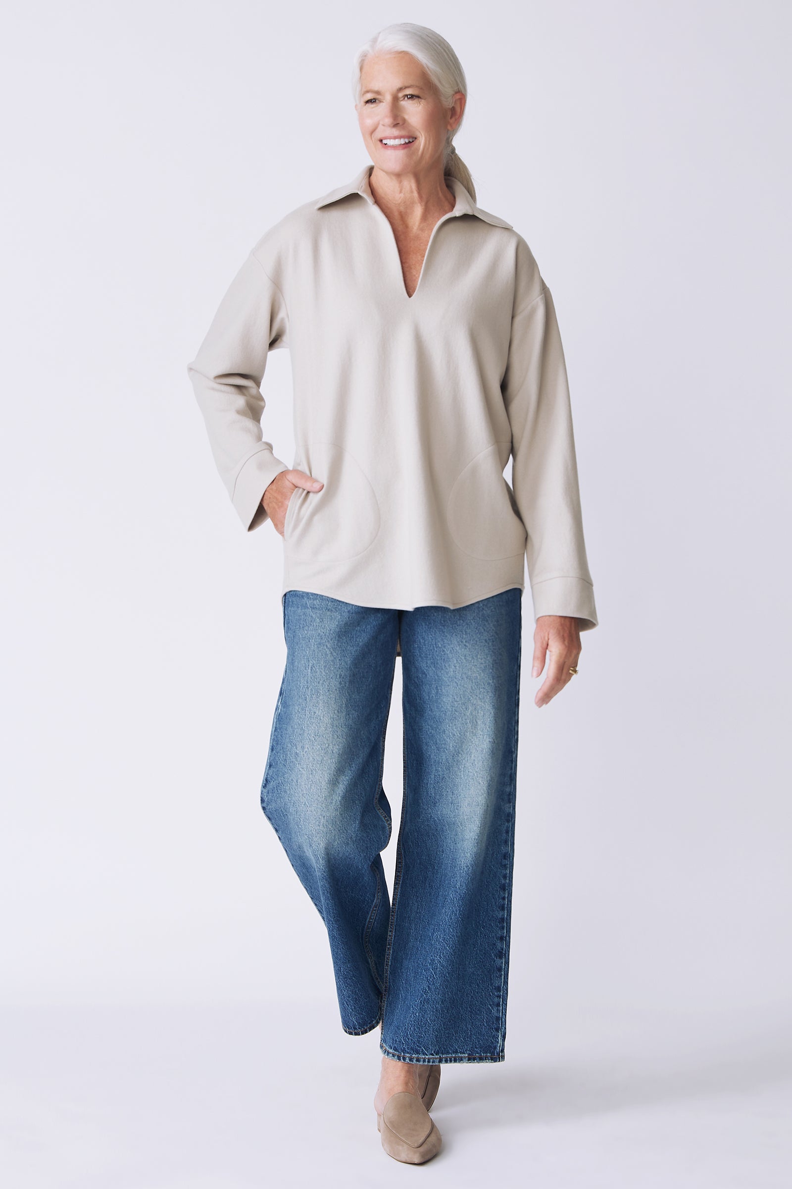 Kal Rieman Julian pullover in mink felted jersey on model front view walking hand on hip