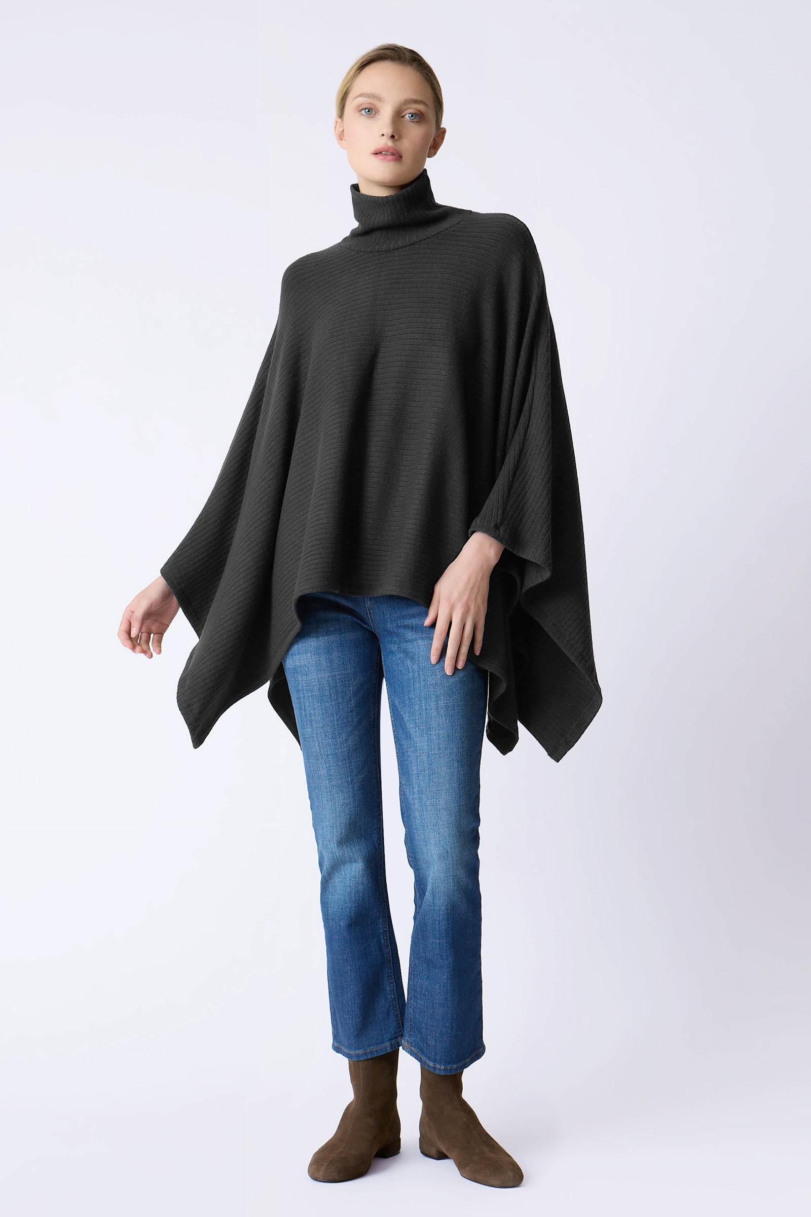Kal Rieman Lee Rib Poncho in black on model swinging arms full front view