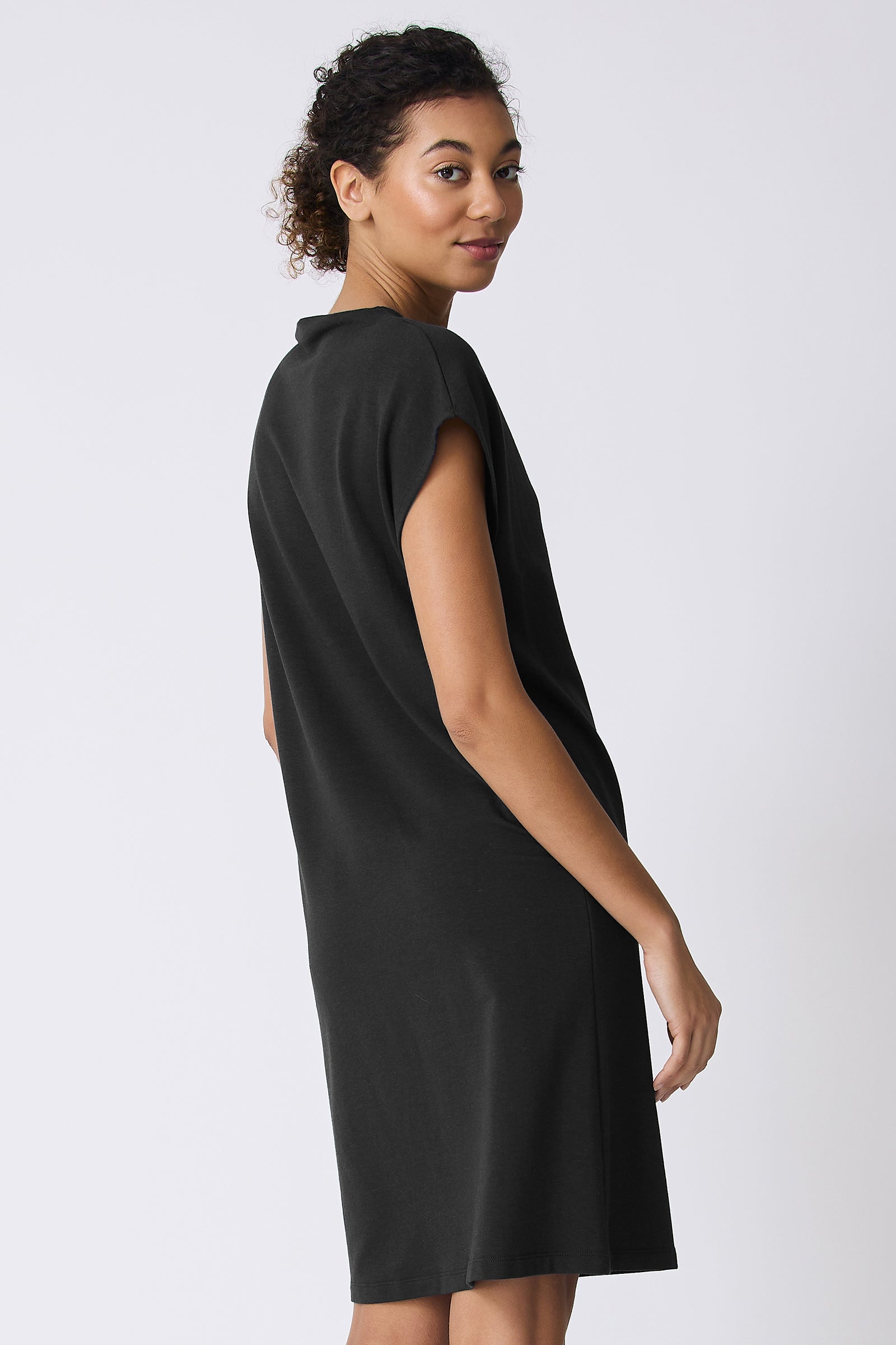 Kal Rieman Luca Cowl Dress in Black on model looking over shoulder back view