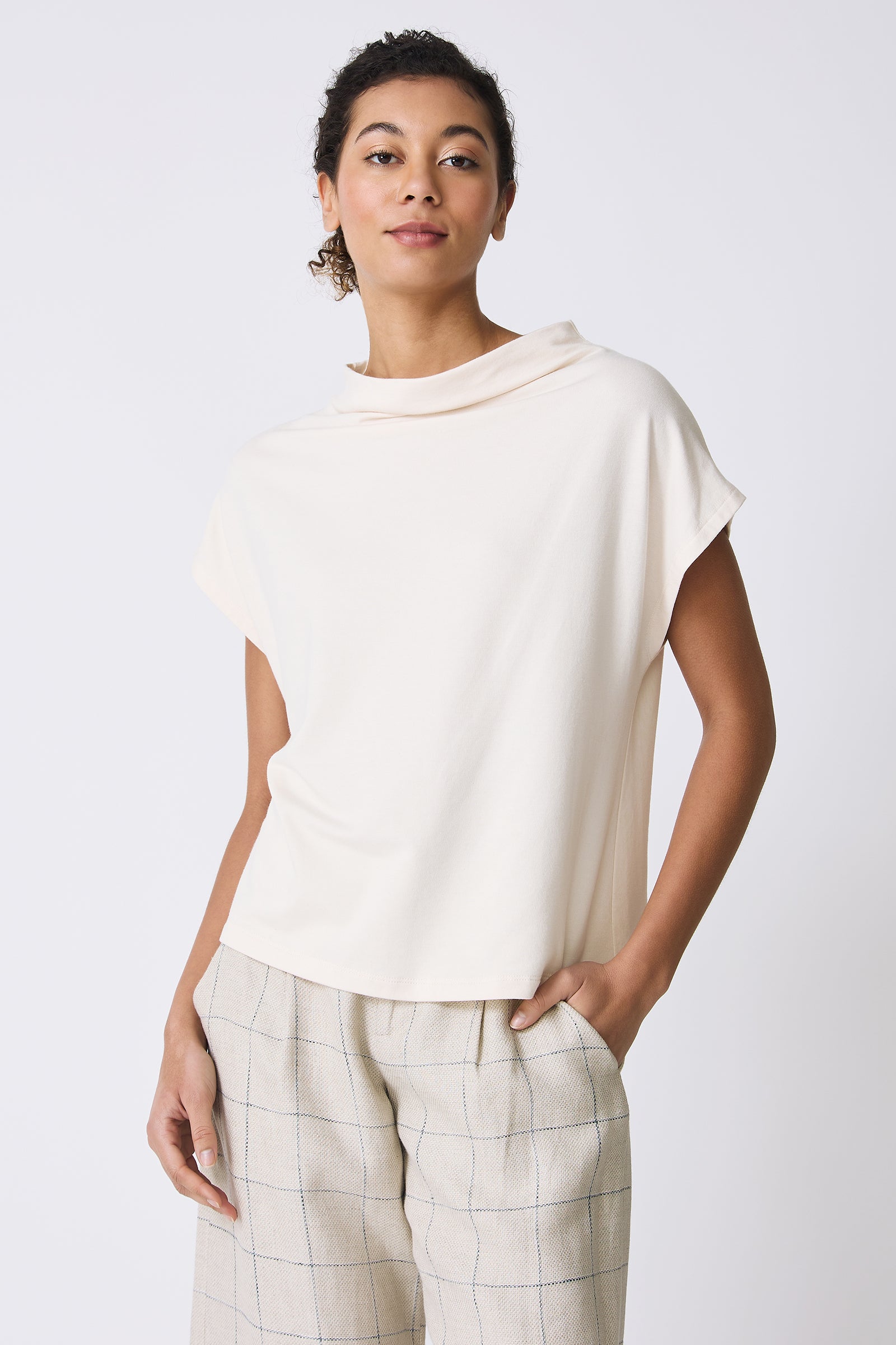 Kal Rieman Luca Cowl Top in Ivory on model with hand in pocket front view
