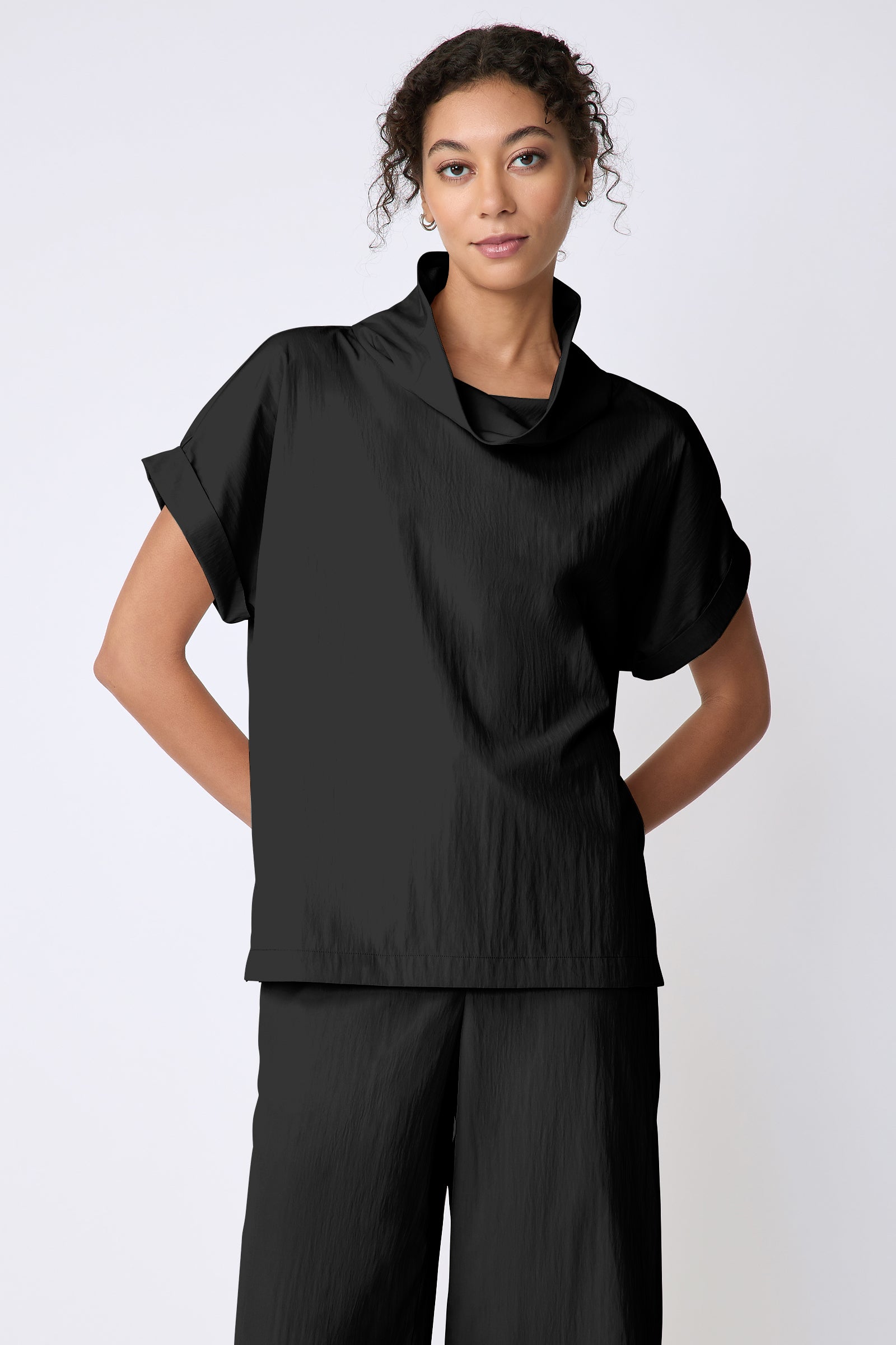 Kal Rieman Maggie Top in Typewriter Cloth black on model front view hands behind back