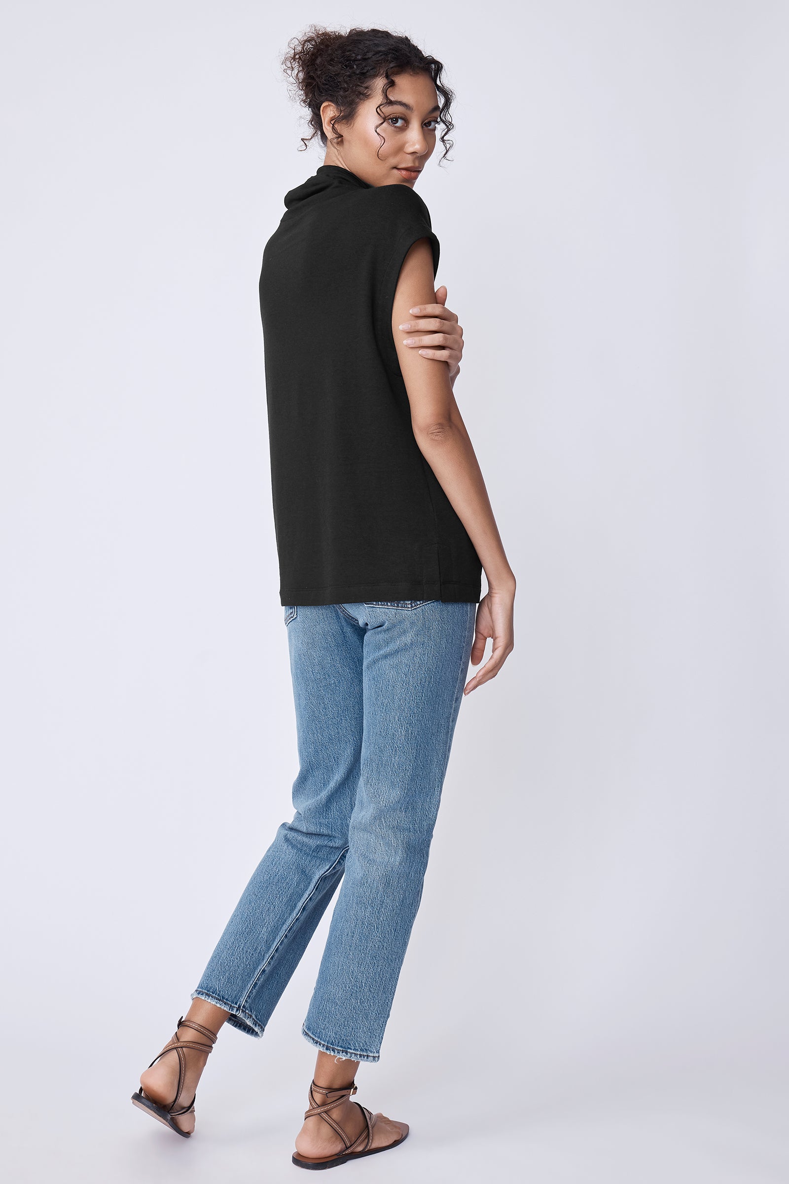 Kal Rieman Margie Tee in black bamboo terry on model holding ties full front view