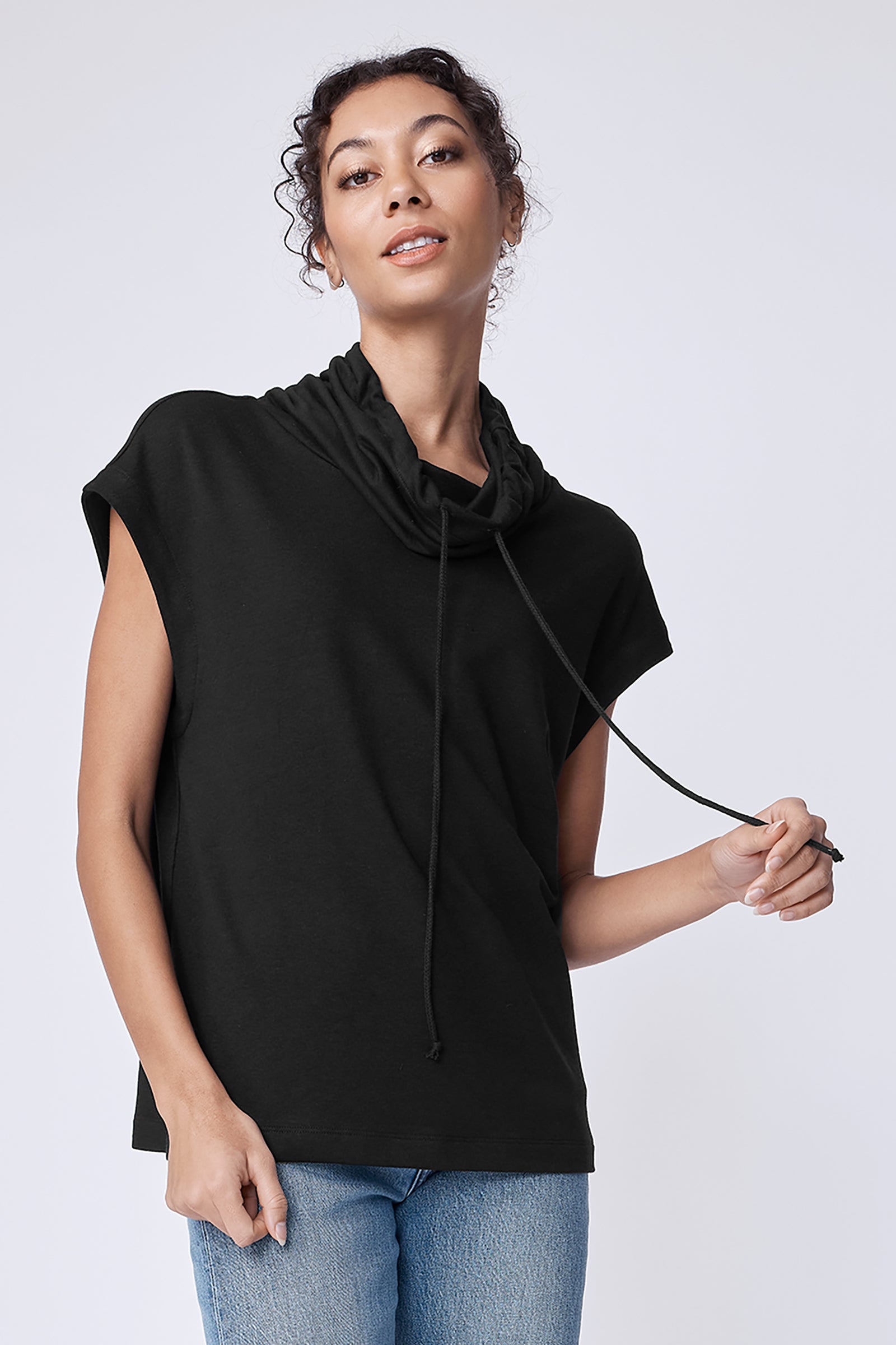 Kal Rieman Margie Tee in black bamboo terry on model holding ties front view