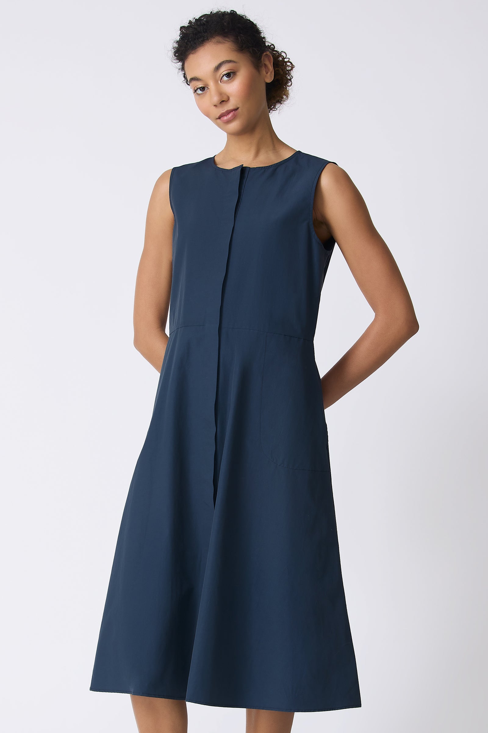 Kal Rieman Marina Dress in Summer Navy on model with hands behind back front view