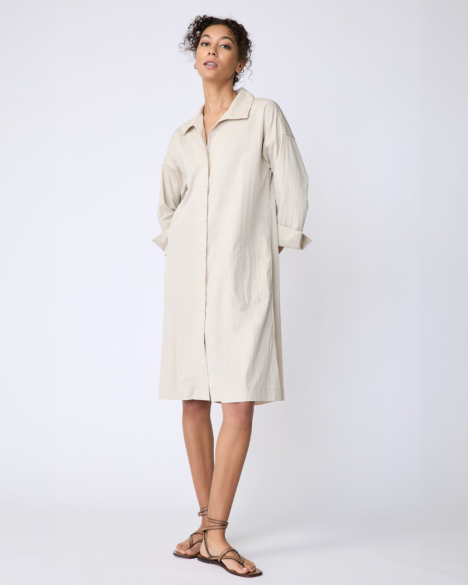 Kal Rieman Marion Shirt Dress in Typewriter cloth khaki on model front view hands behind back